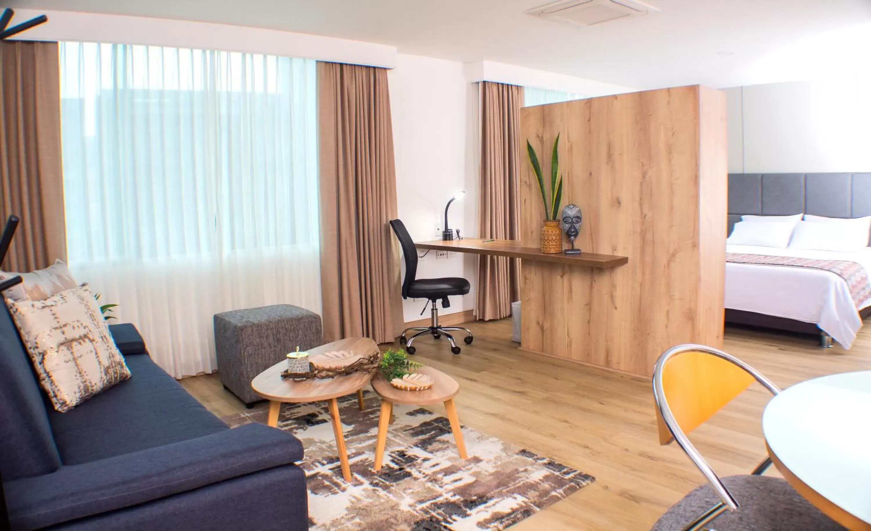 Living room, Seating Area in Novelty Suites Hotel