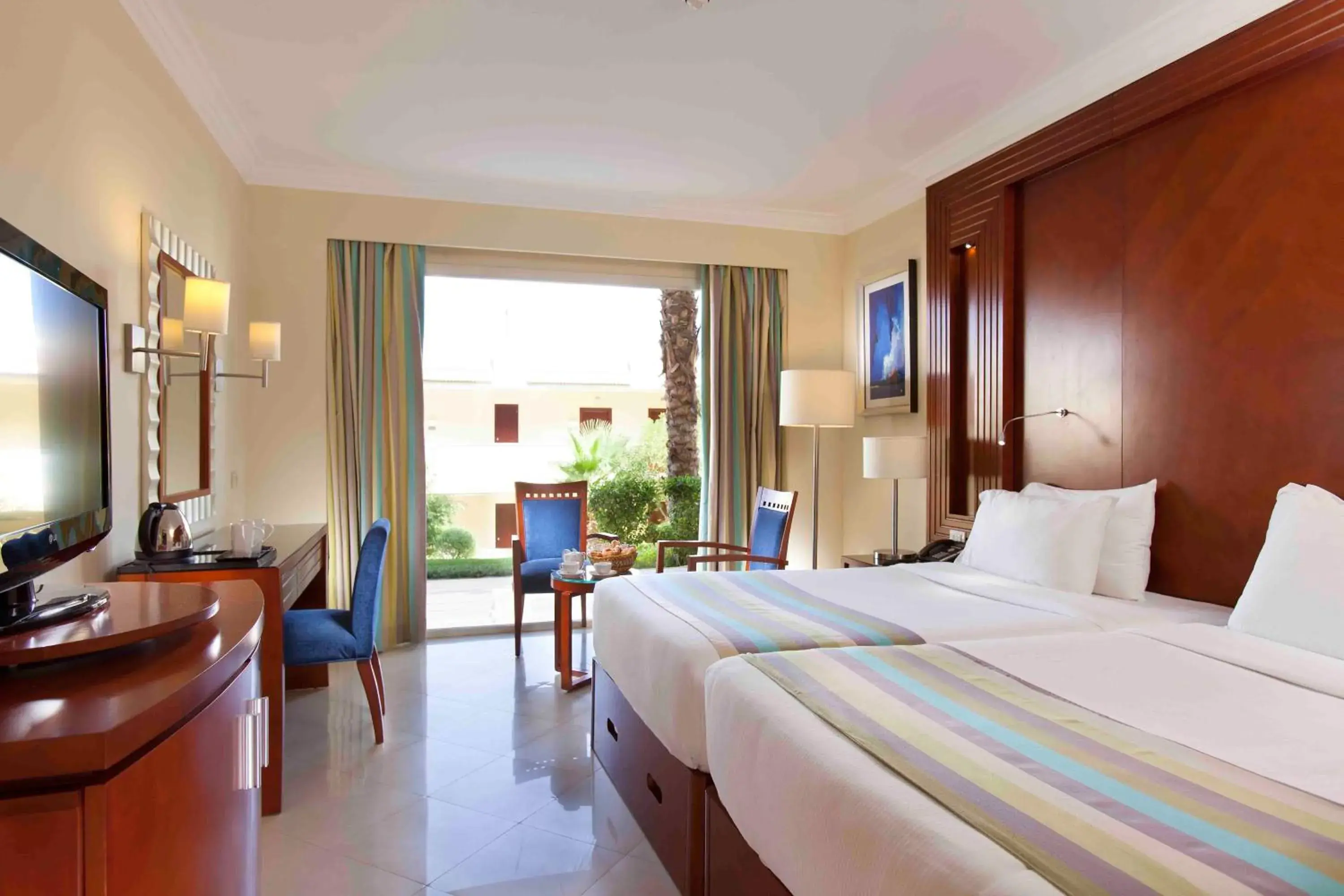 Bed in Xperience Sea Breeze Resort