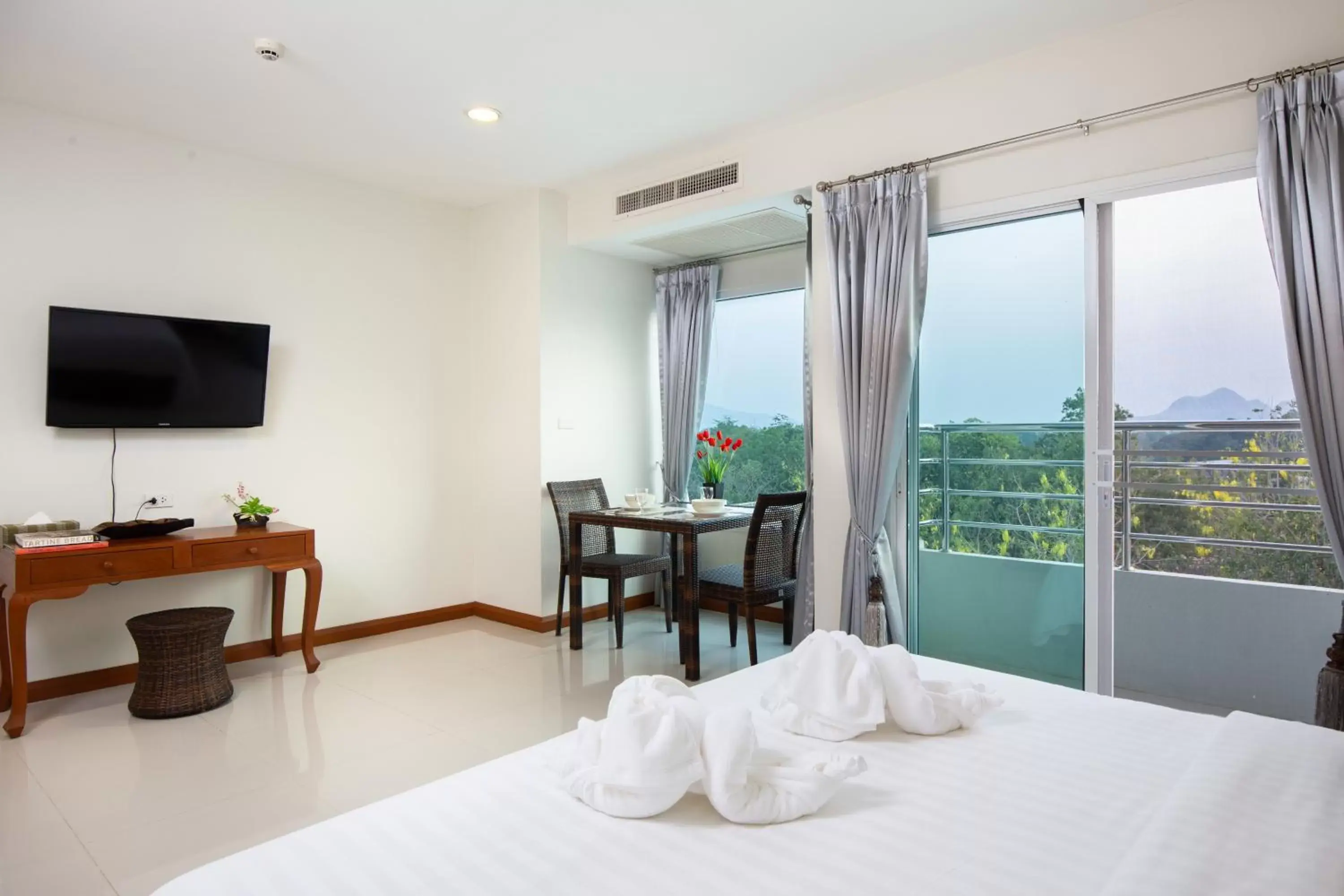 Bed, TV/Entertainment Center in Kanchanaburi City Hotel - SHA Extra Plus