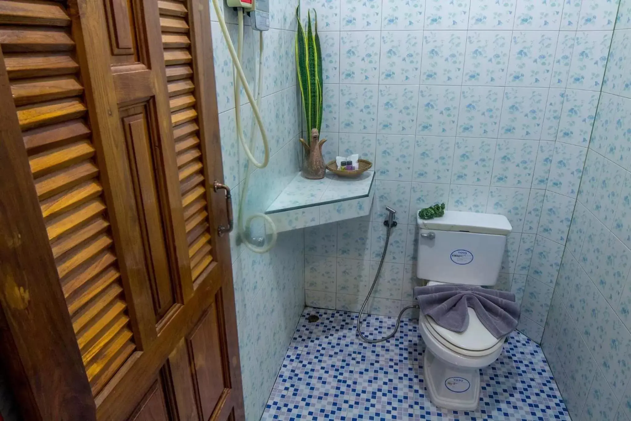 Photo of the whole room, Bathroom in Pongphen Guesthouse - SHA Plus Certified