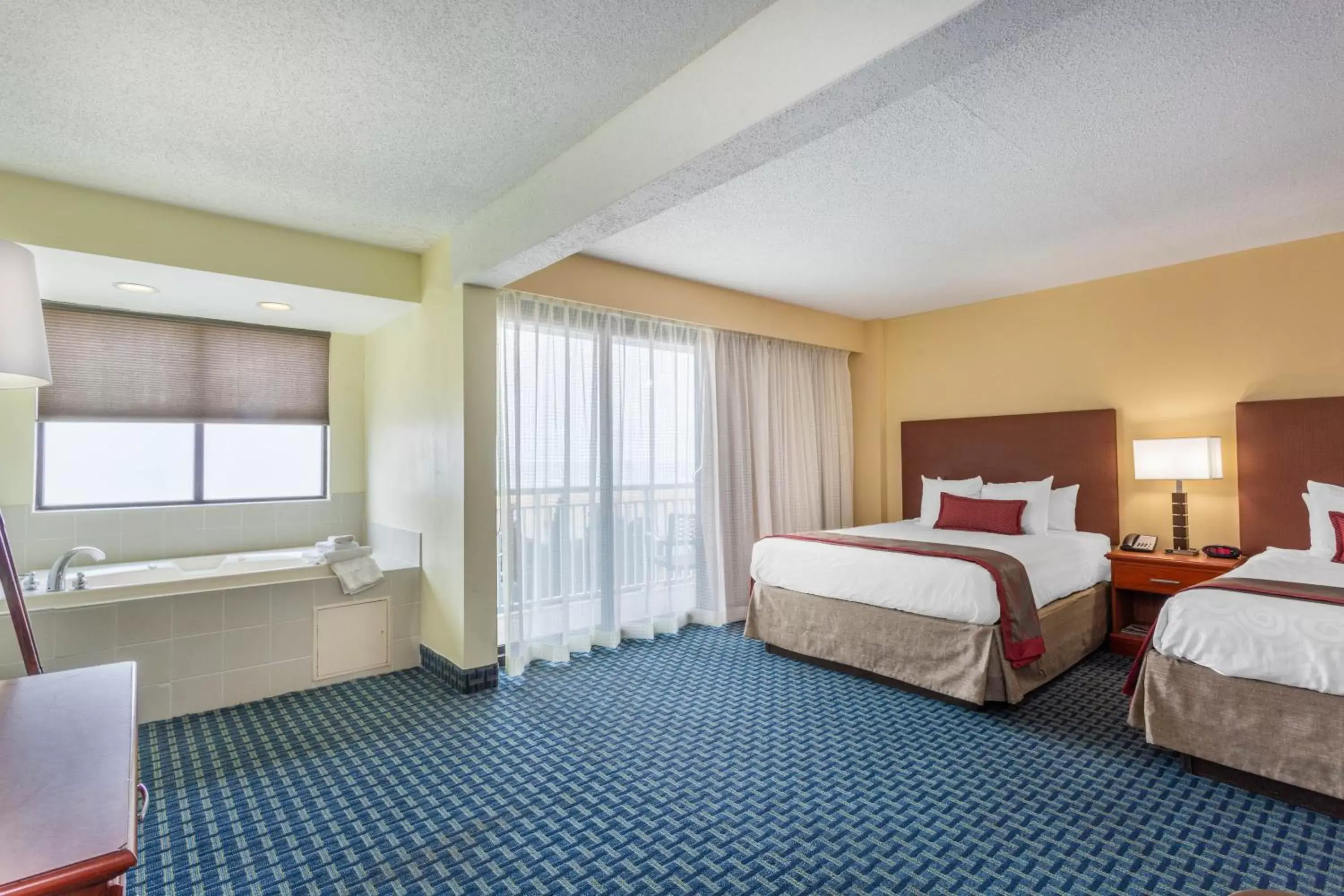 Hot Tub, Bed in Ramada Plaza by Wyndham Virginia Beach