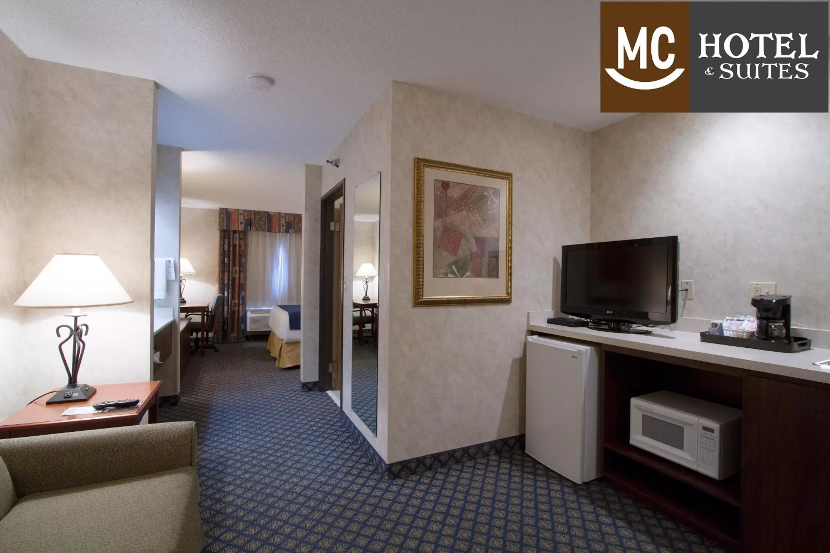 Seating area, TV/Entertainment Center in Miles City Hotel & Suites