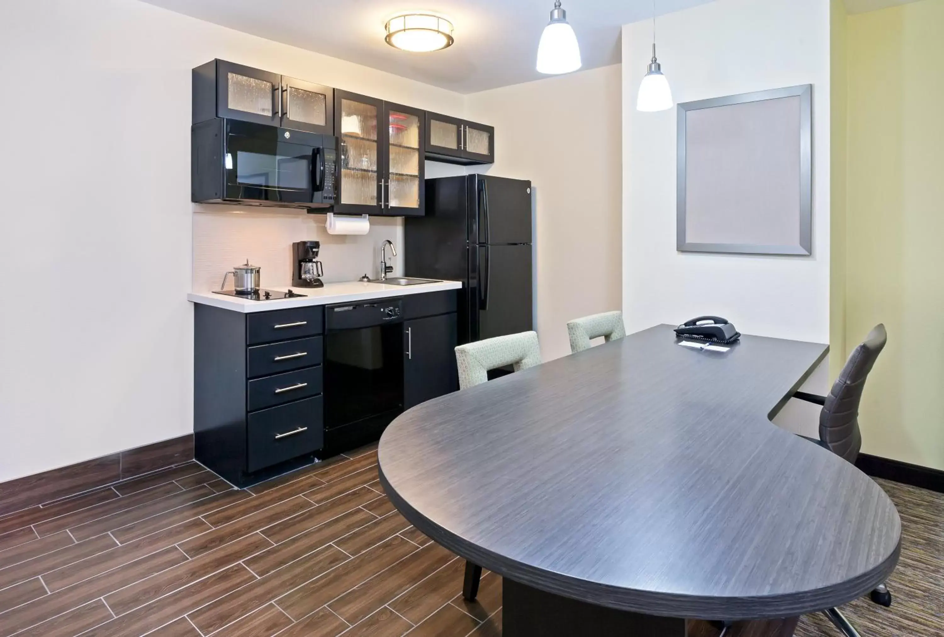 Photo of the whole room, Kitchen/Kitchenette in Candlewood Suites San Angelo, an IHG Hotel