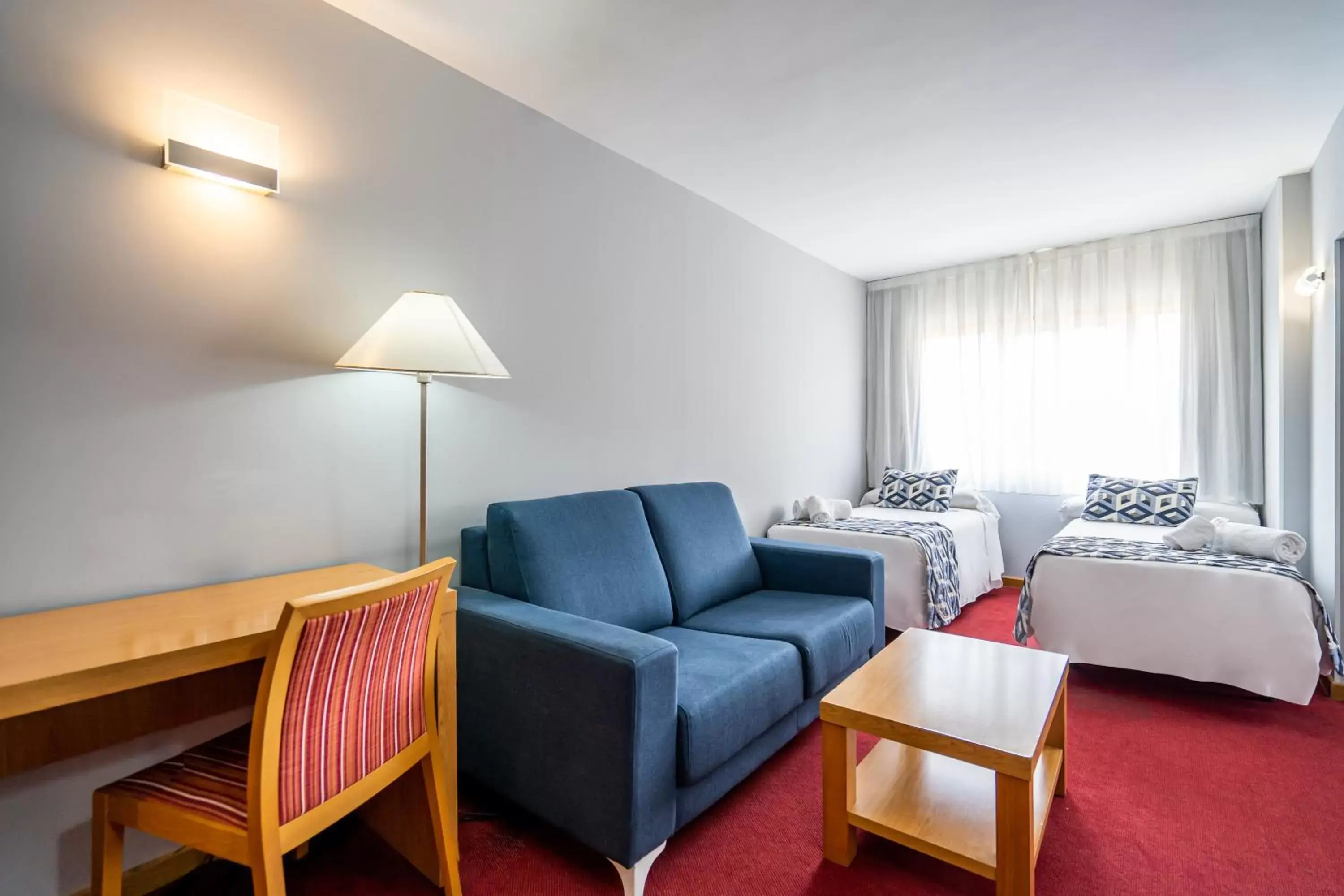 Bed, Seating Area in Hotel Beleret