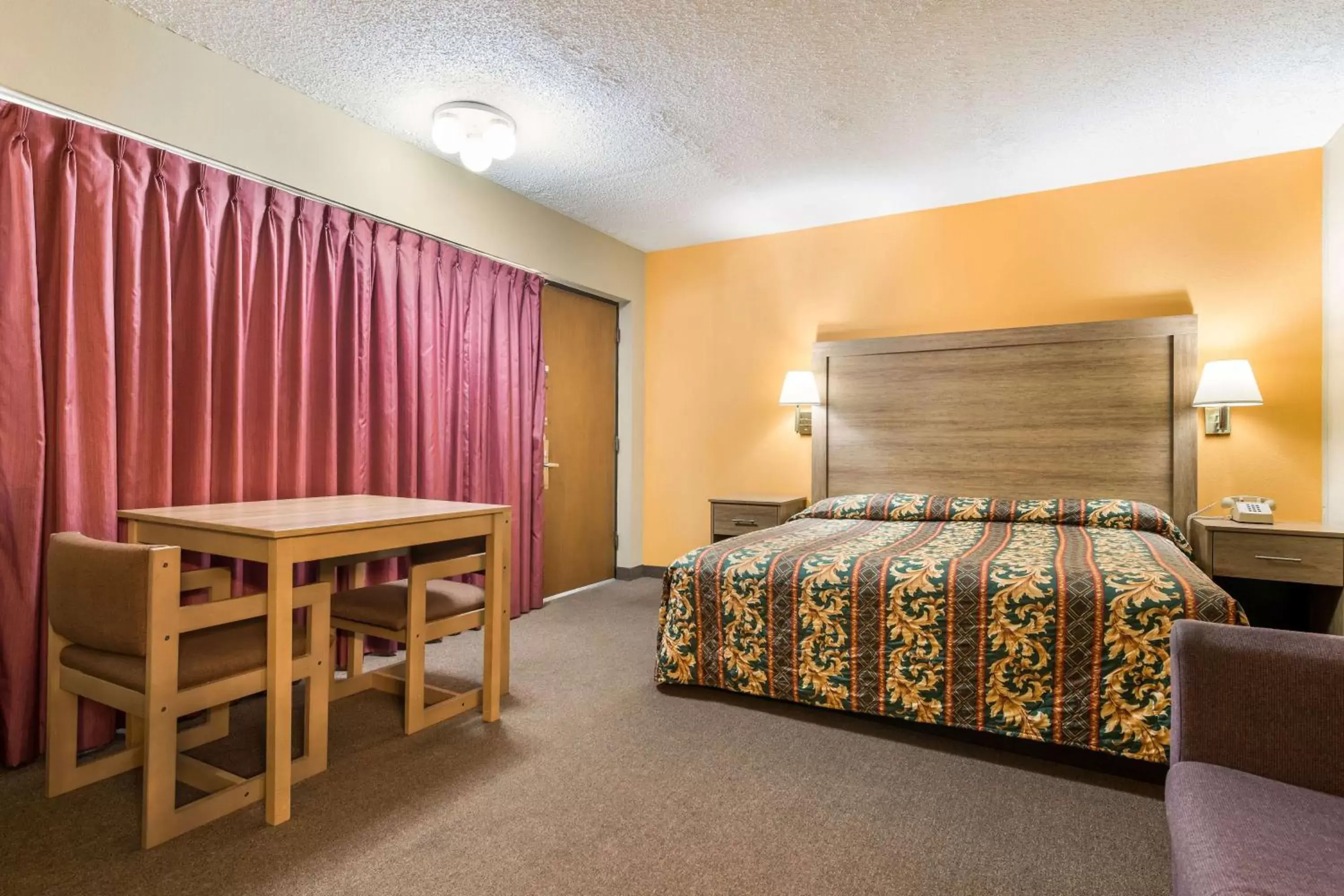 Bed in LeConte Motor Lodge A Ramada by Wyndham