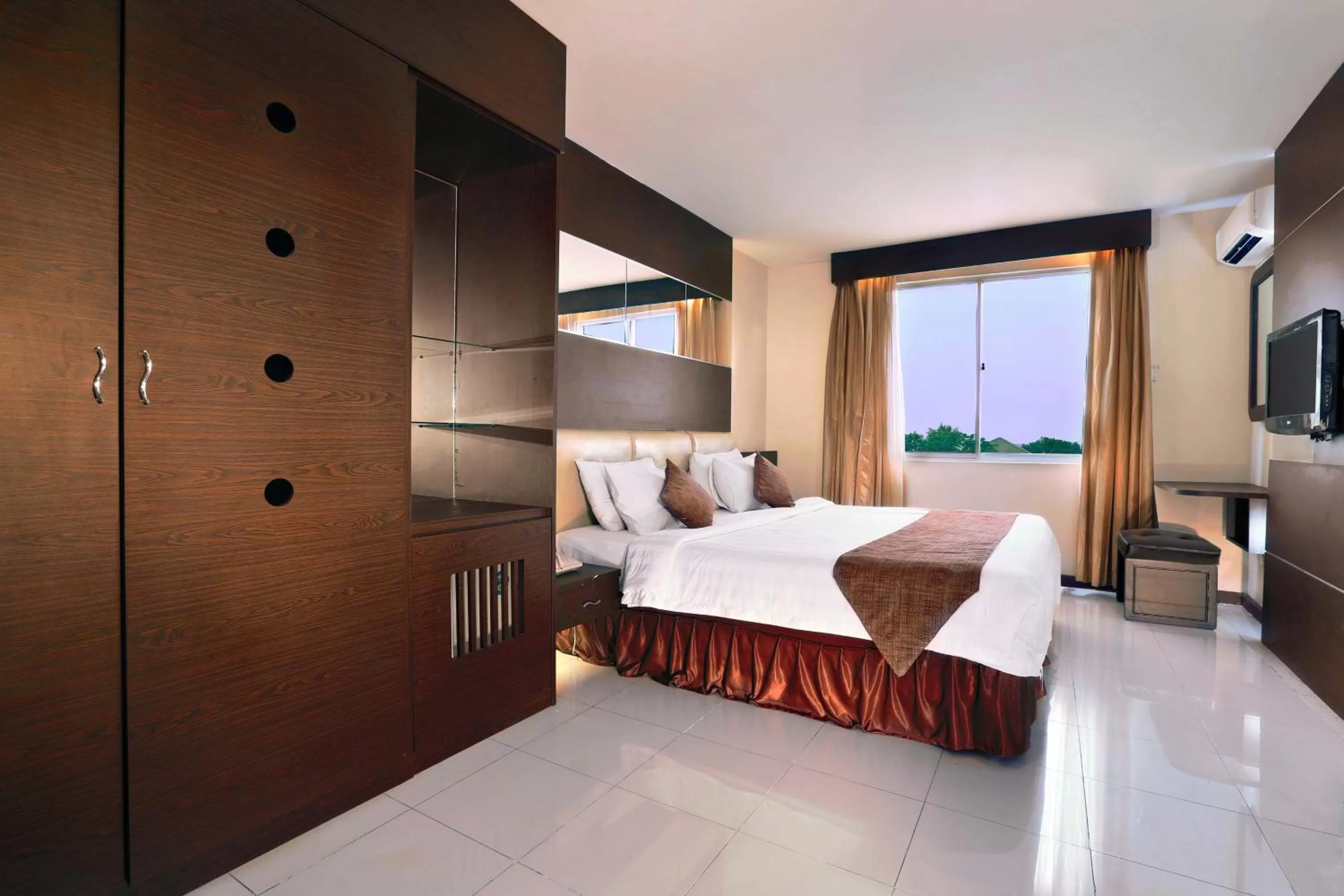 Bed in Aston Karimun City Hotel