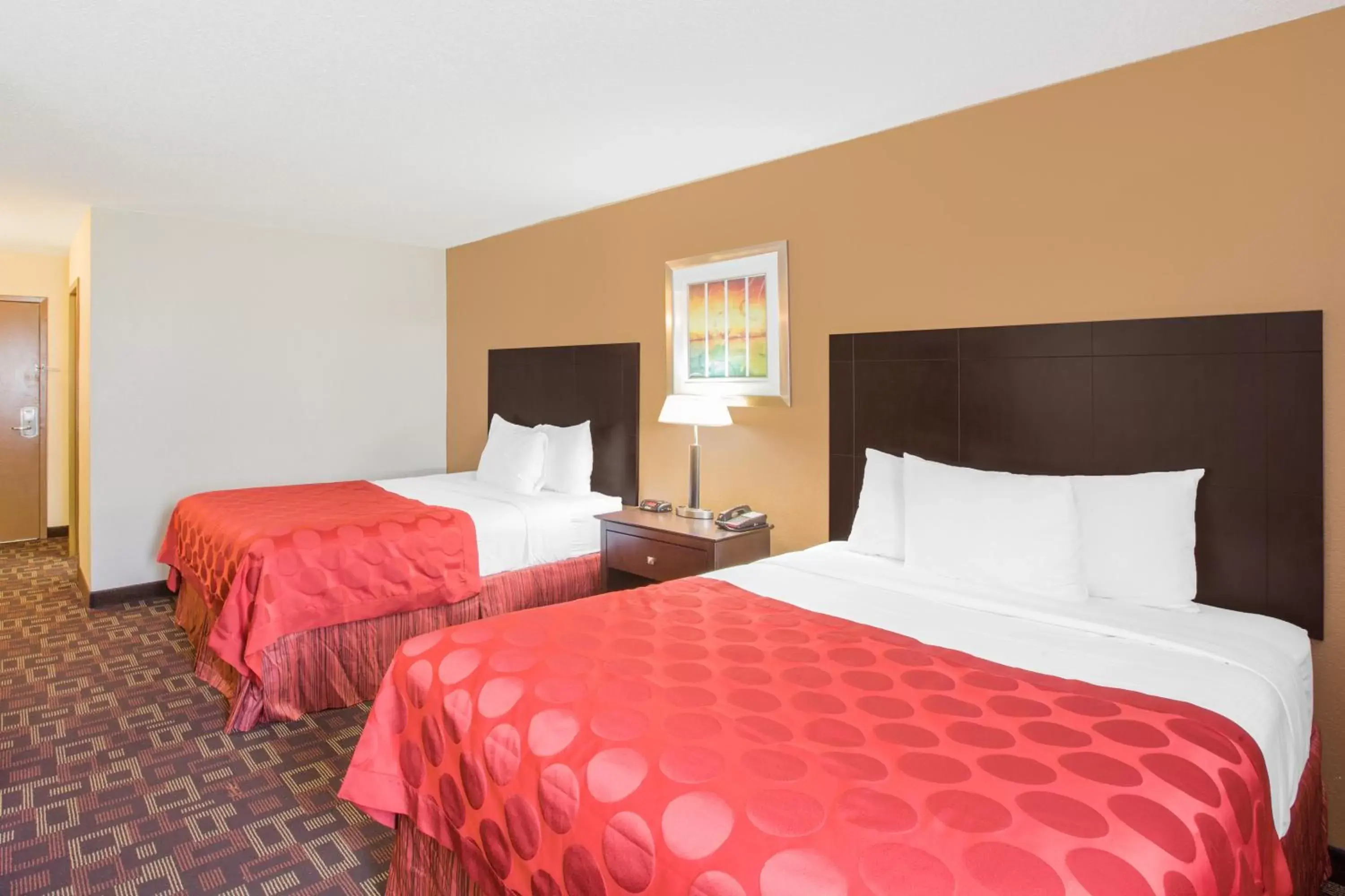 Bed in Ramada by Wyndham Tulsa