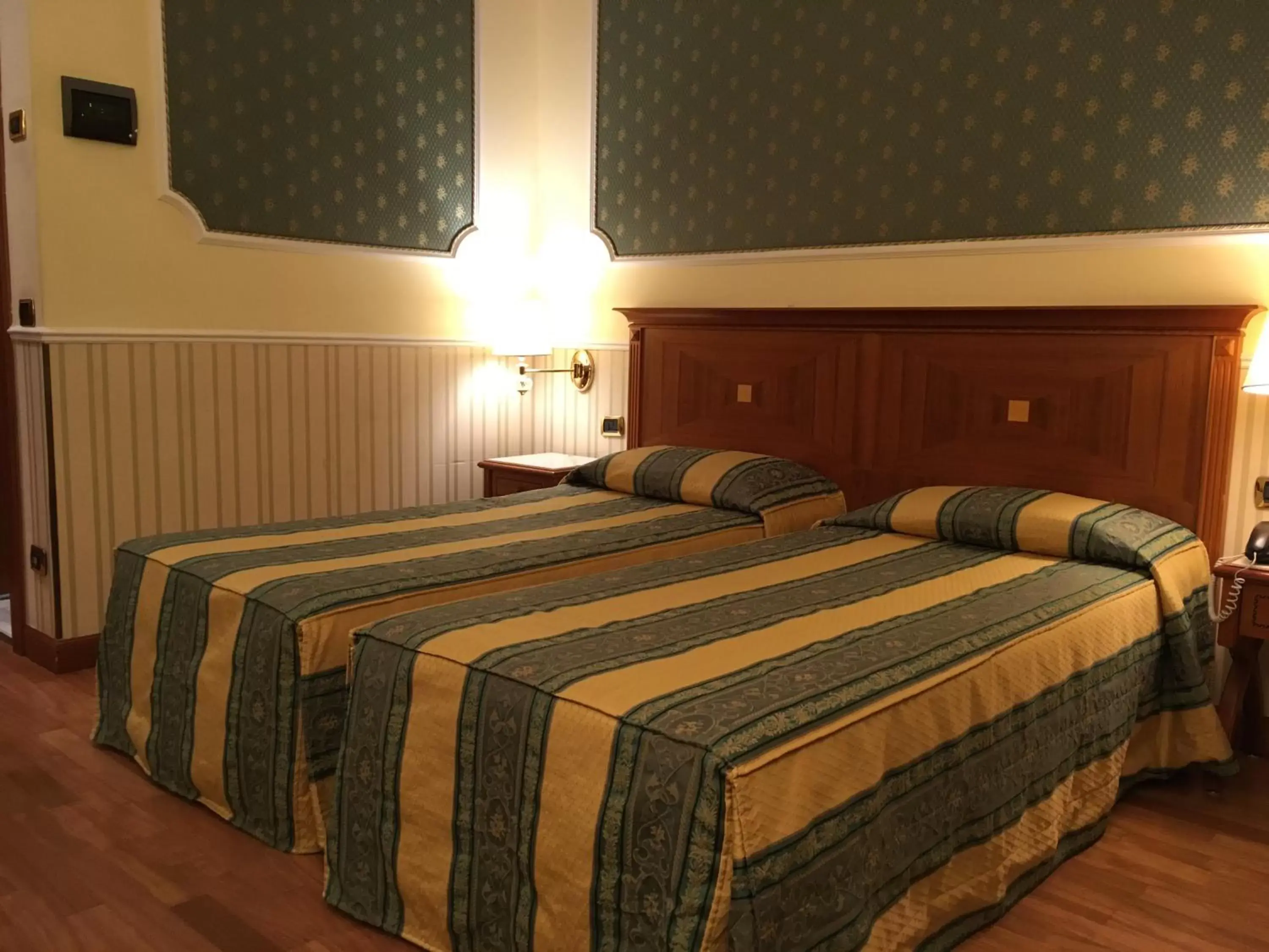 Bed in Andreola Central Hotel