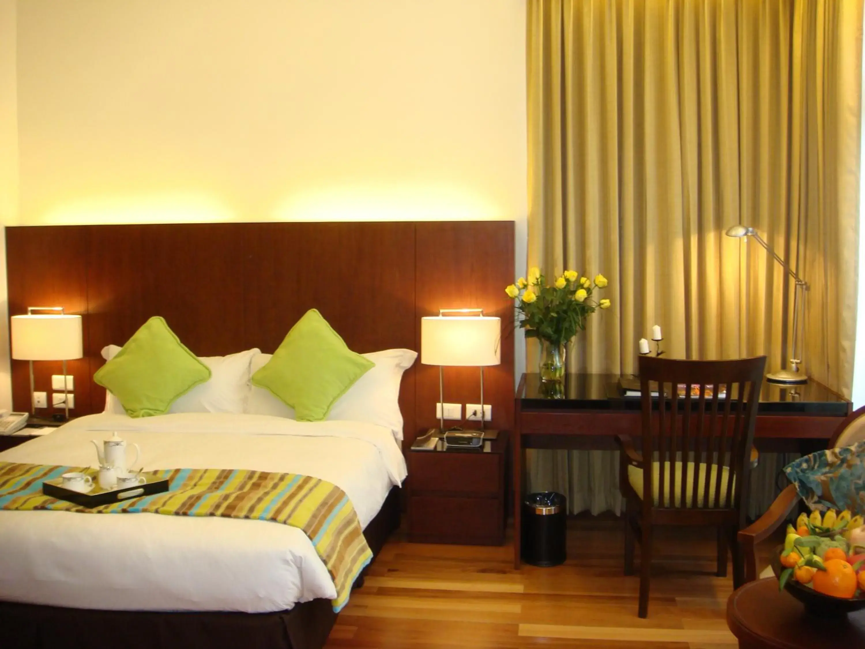 Seating area, Bed in Fraser Suites Hanoi