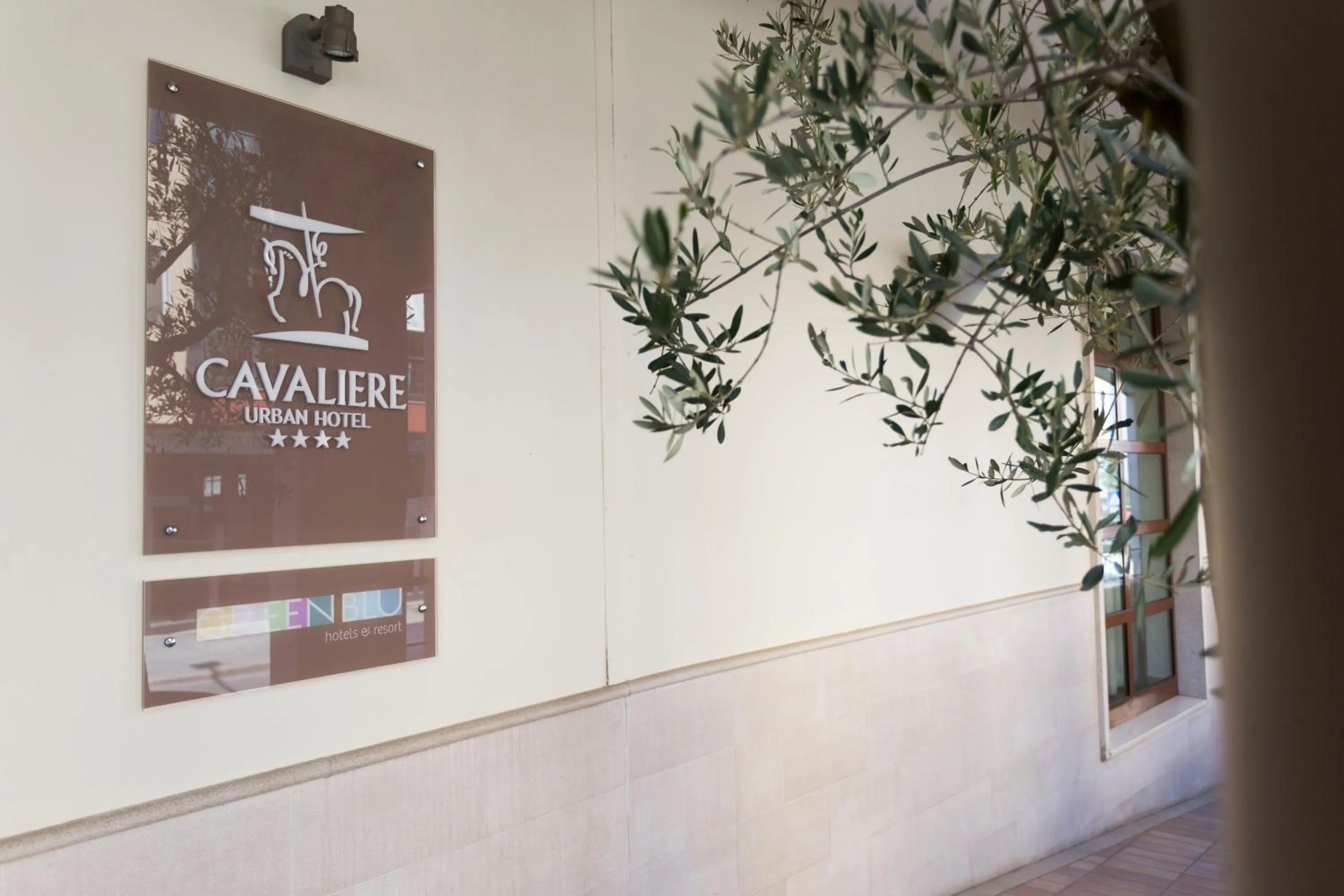 Property logo or sign in Hotel Cavaliere