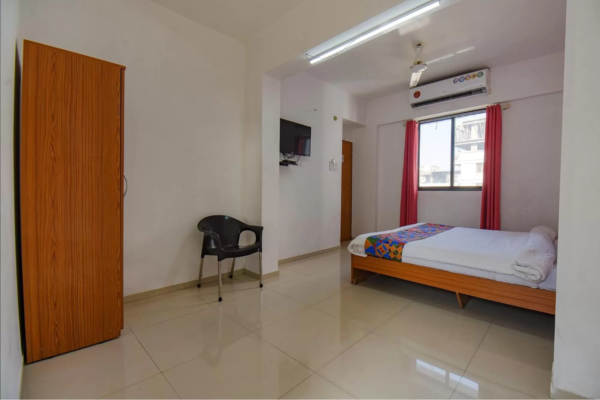 Communal lounge/ TV room, Bed in FabHotel Aakiyo