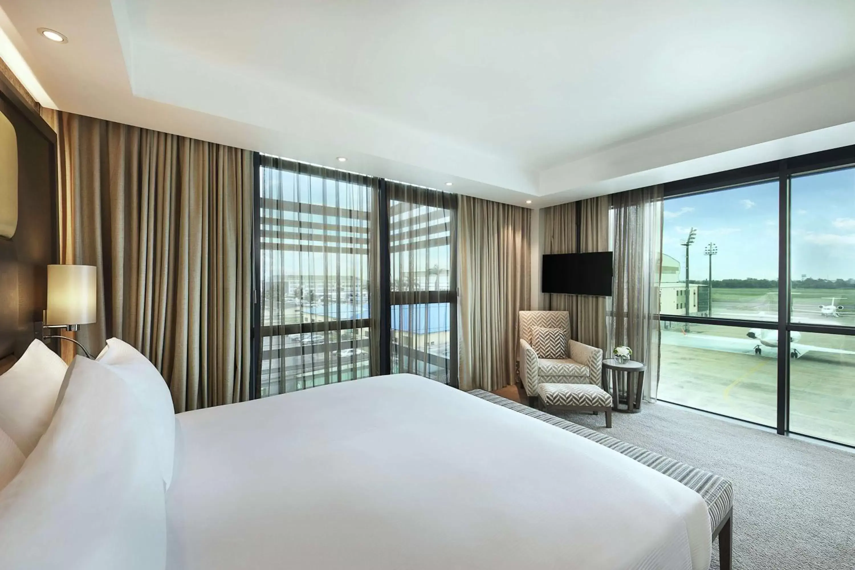 Bed in Legend Hotel Lagos Airport, Curio Collection By Hilton