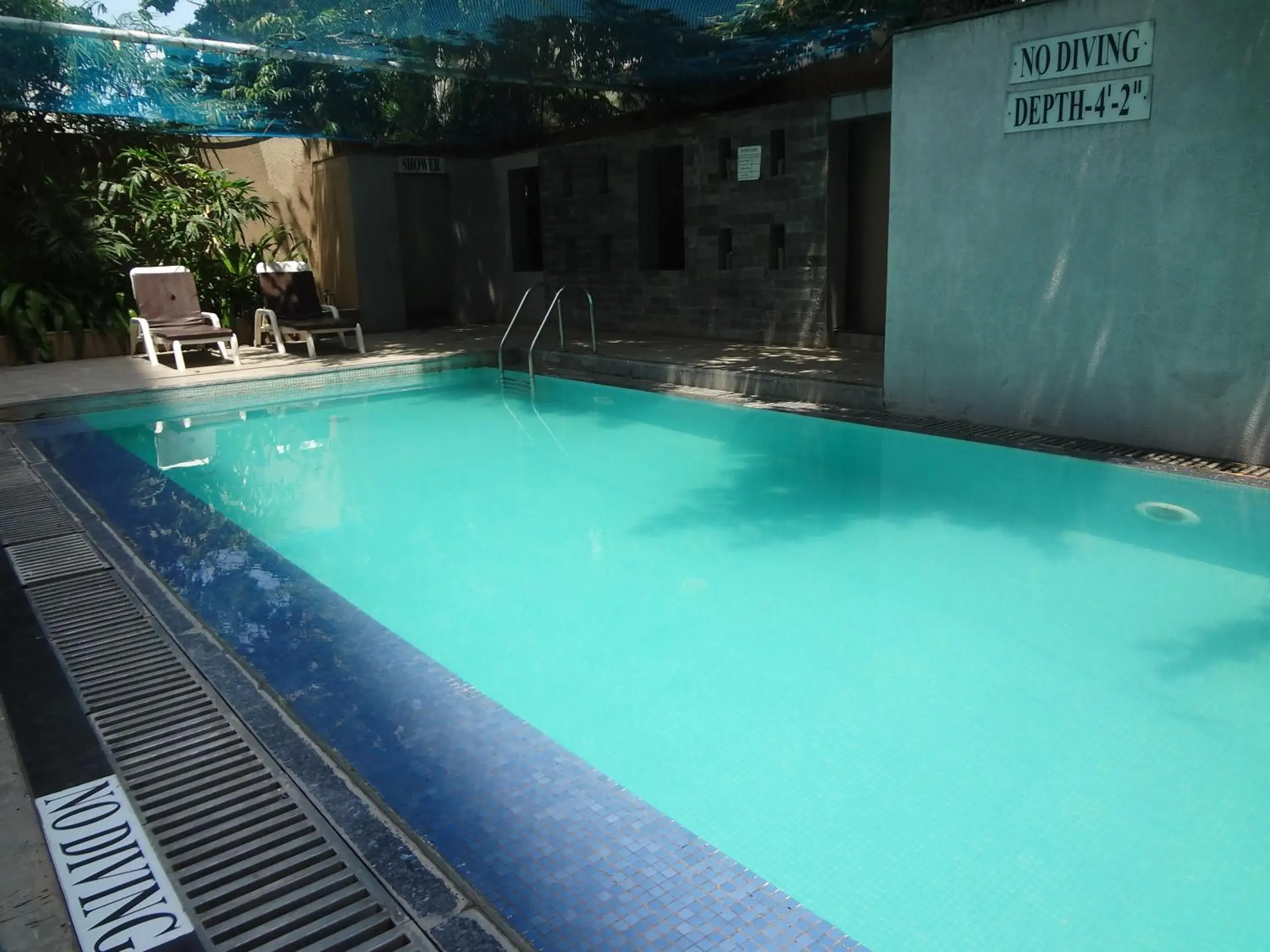 Swimming pool, Property Building in Pride Plaza Hotel, Ahmedabad