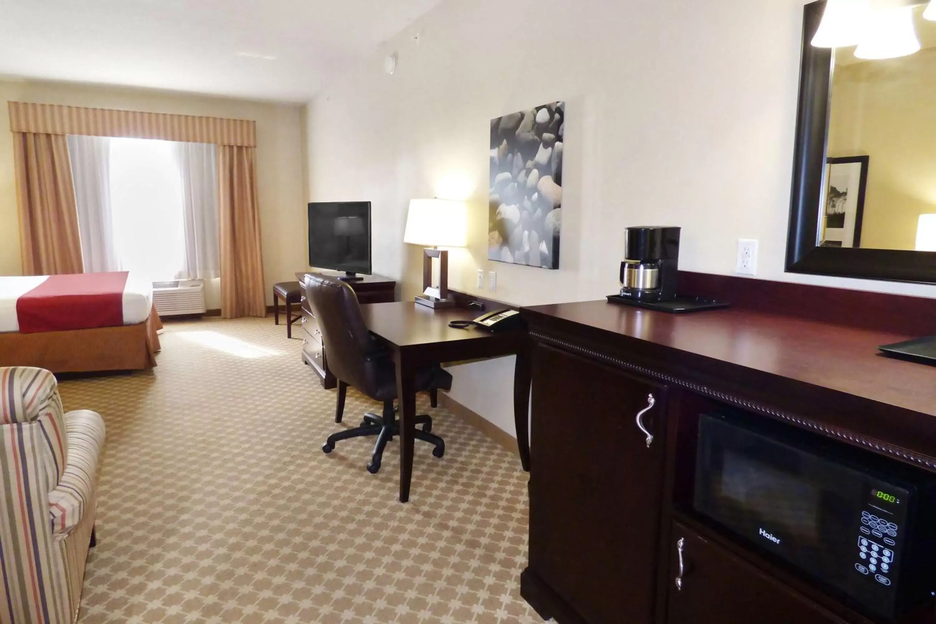 Photo of the whole room, TV/Entertainment Center in Country Inn & Suites by Radisson, Port Orange-Daytona, FL