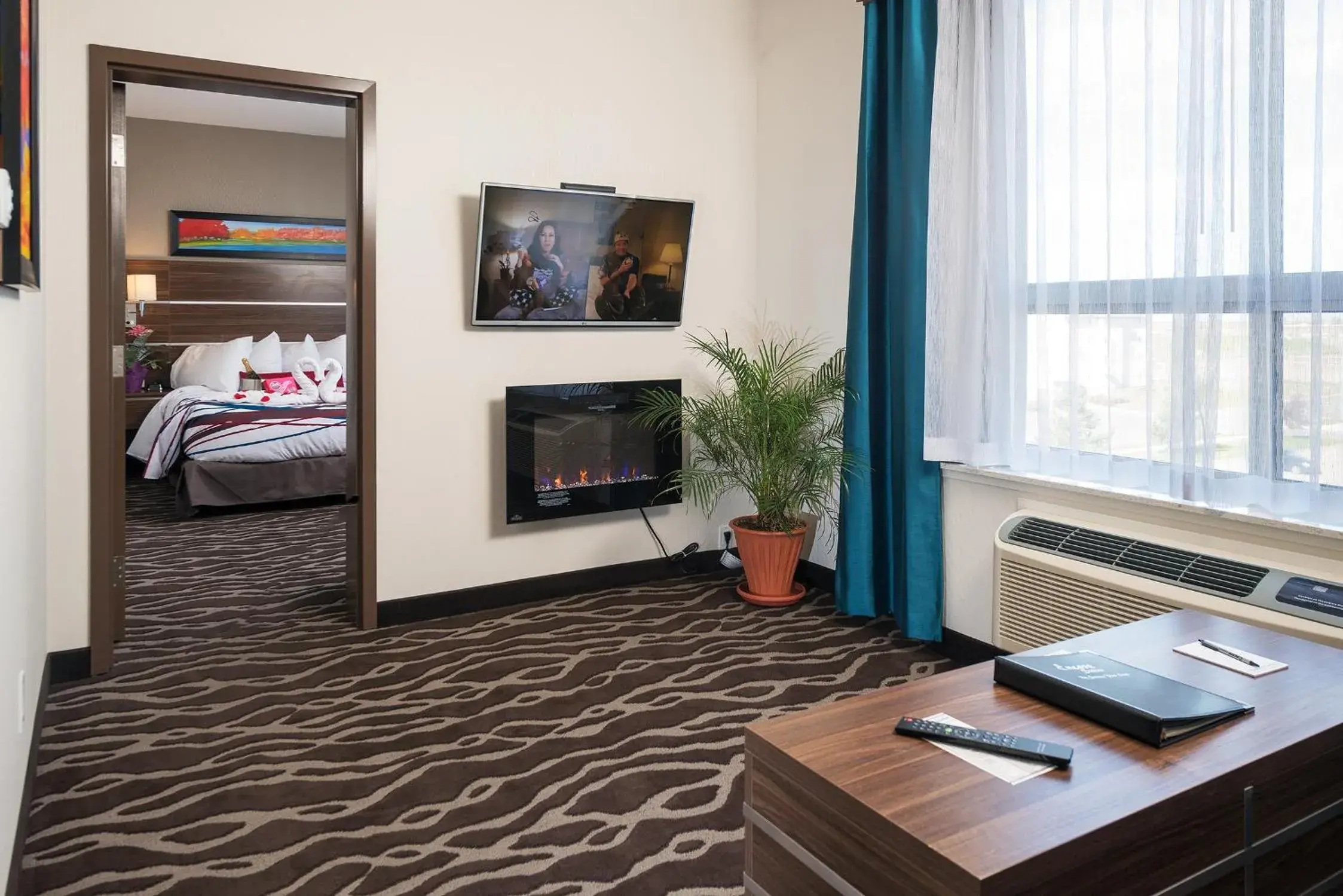 TV and multimedia, Bed in Encore Suites by Service Plus Inns TV and multimedia, Bed in Encore Suites by Service Plus Inns