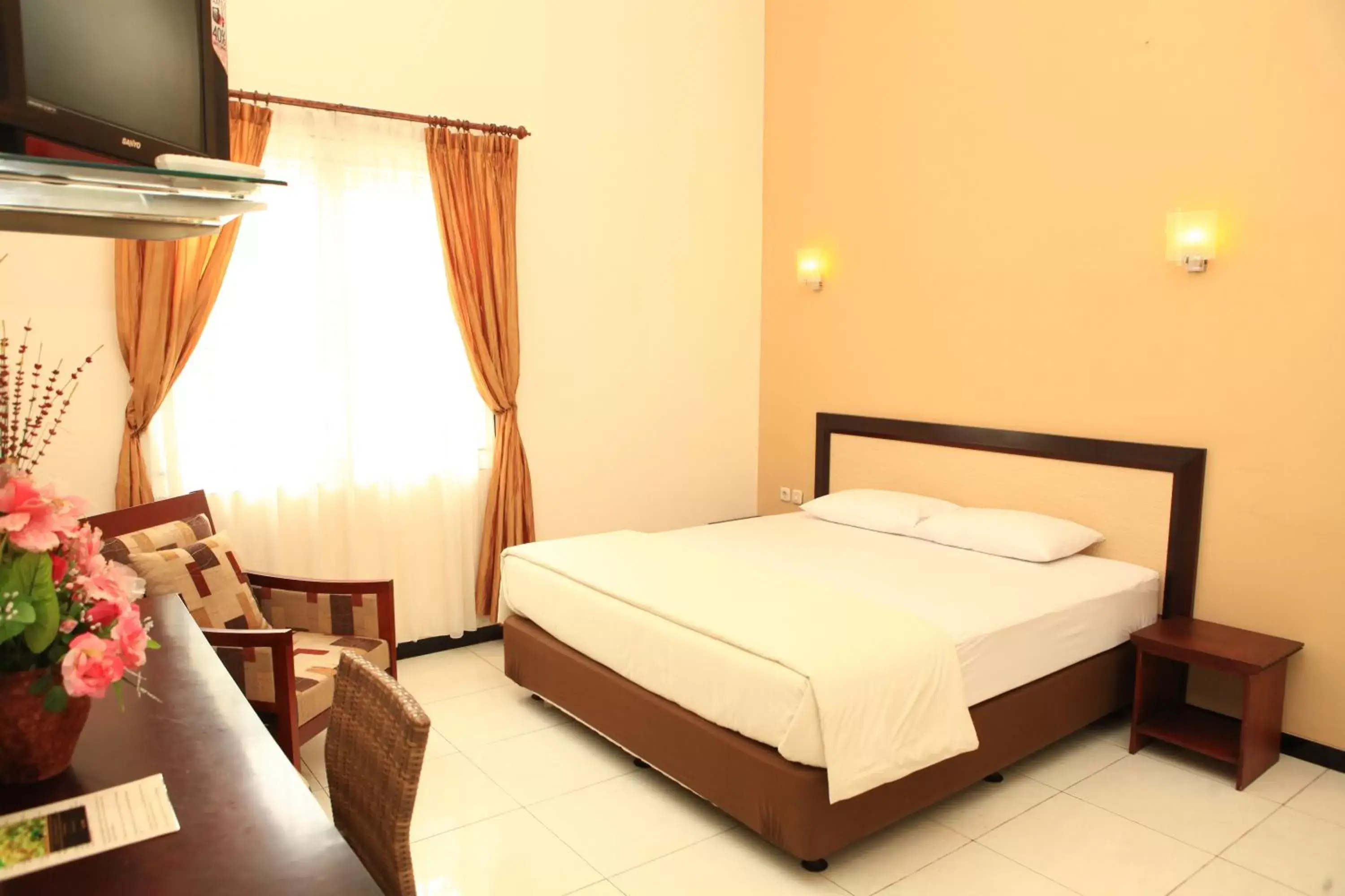 Communal lounge/ TV room, Bed in Arya Graha Semarang Communal lounge/ TV room, Bed in Arya Graha Semarang