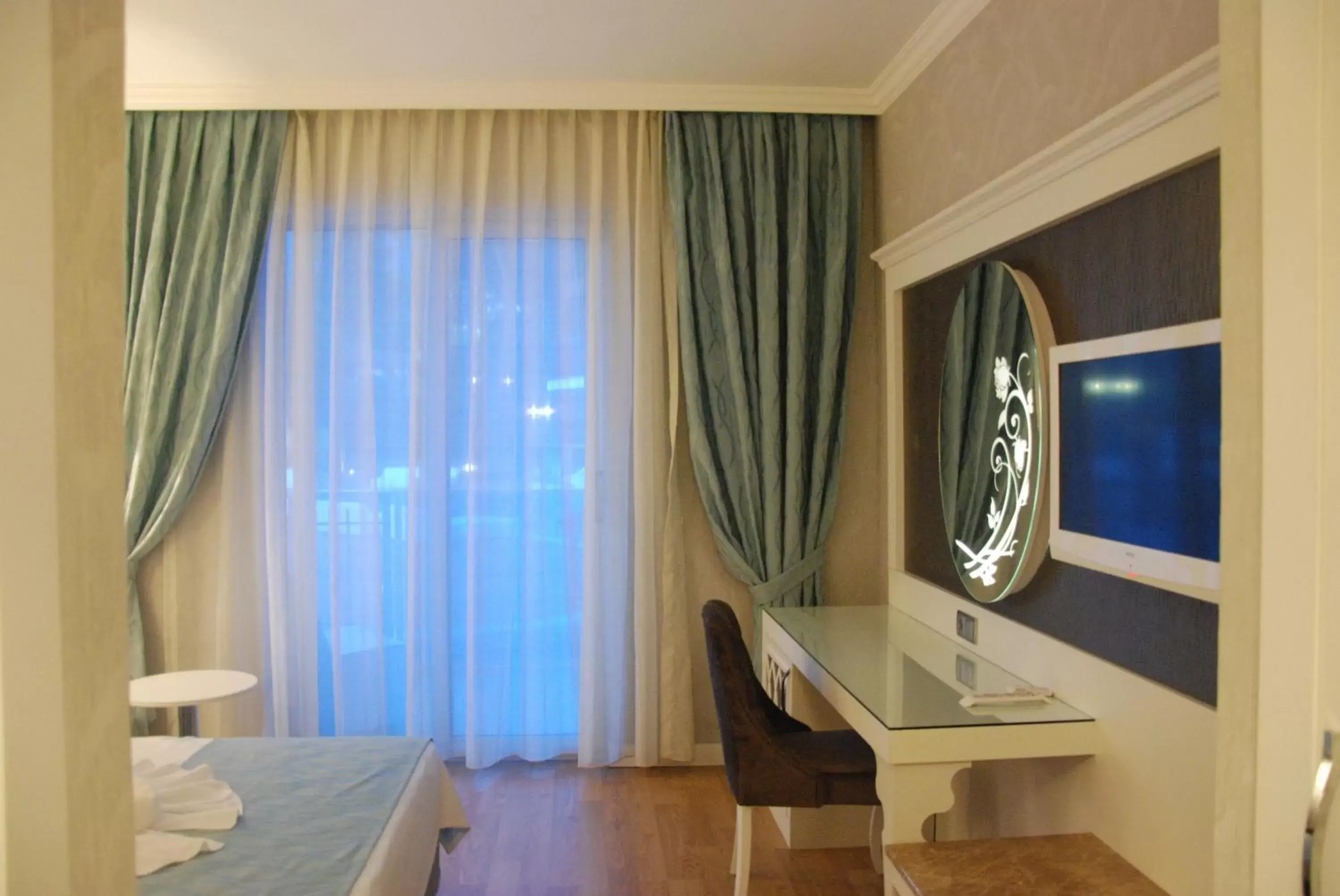 Bed, TV/Entertainment Center in Ocean Blue High Class Hotel & SPA