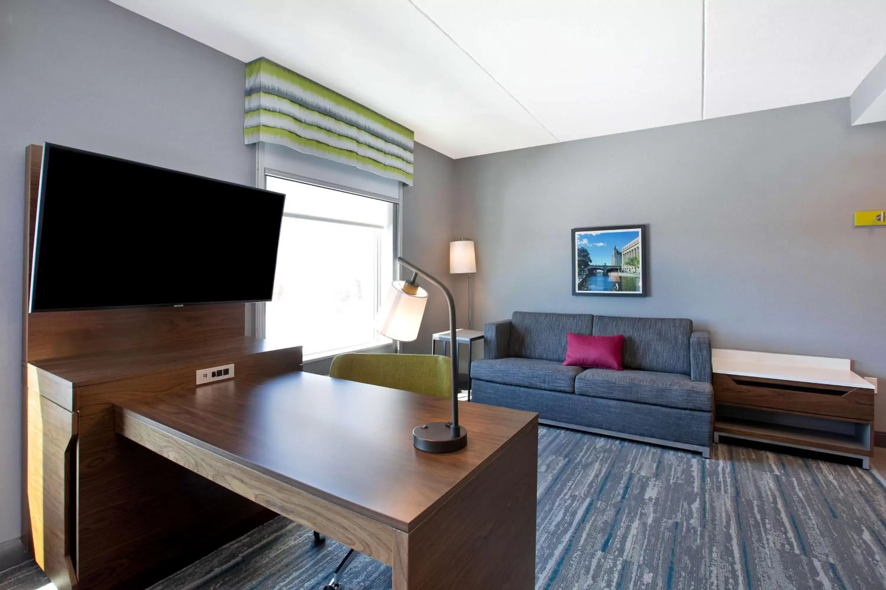 Living room, TV/Entertainment Center in Hampton Inn & Suites Ottawa West, Ontario, Canada