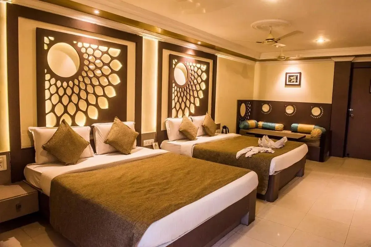 Bed in Hotel Pushpak
