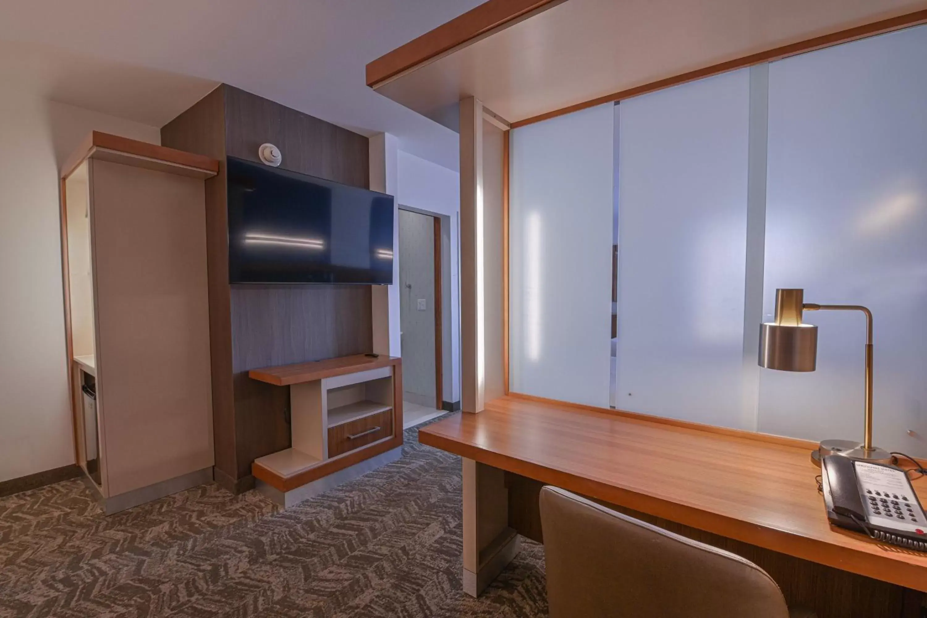 Photo of the whole room, TV/Entertainment Center in SpringHill Suites Grand Forks