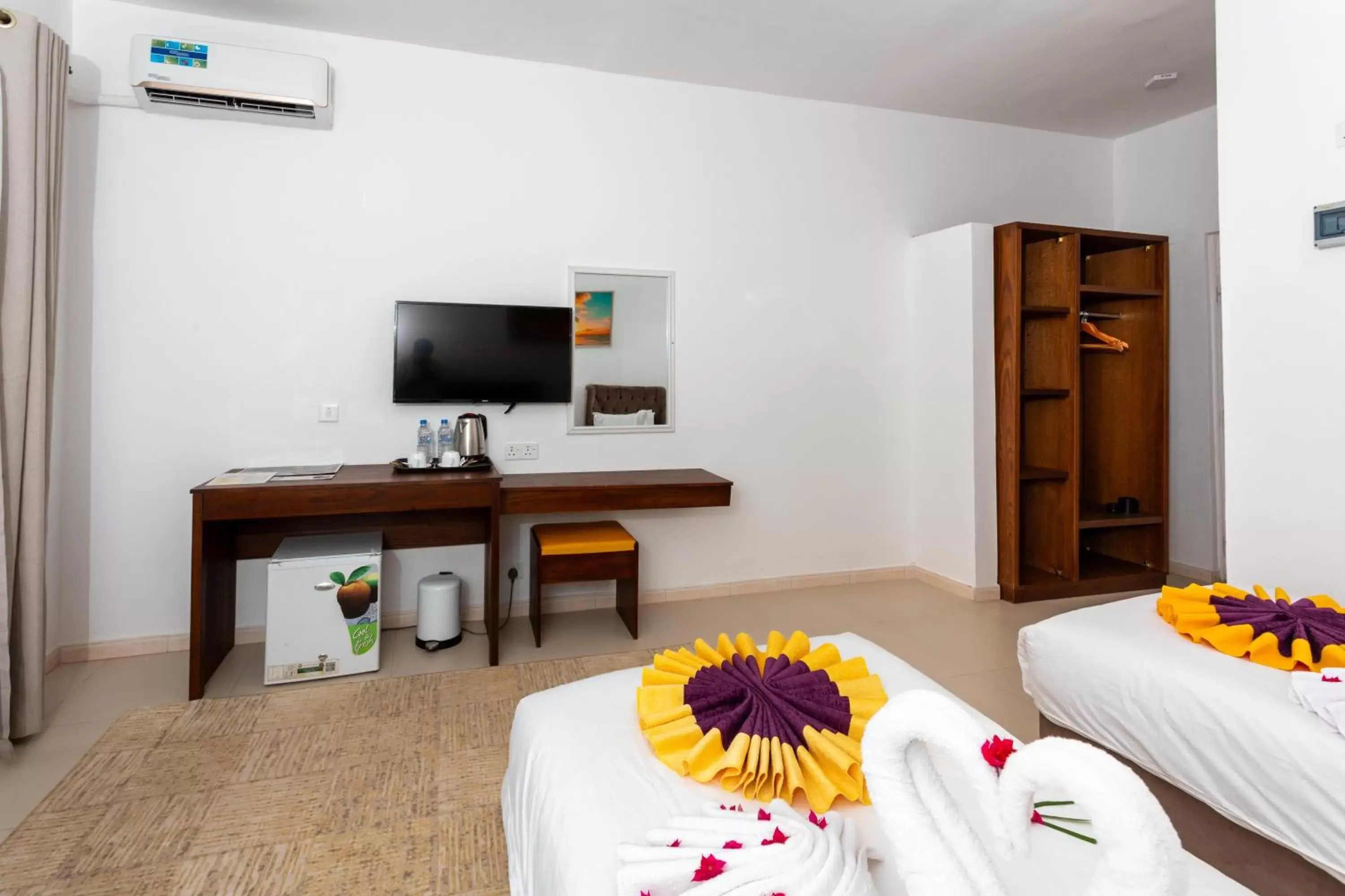 Bedroom, TV/Entertainment Center in Canary Nungwi Hotel & Free SPA