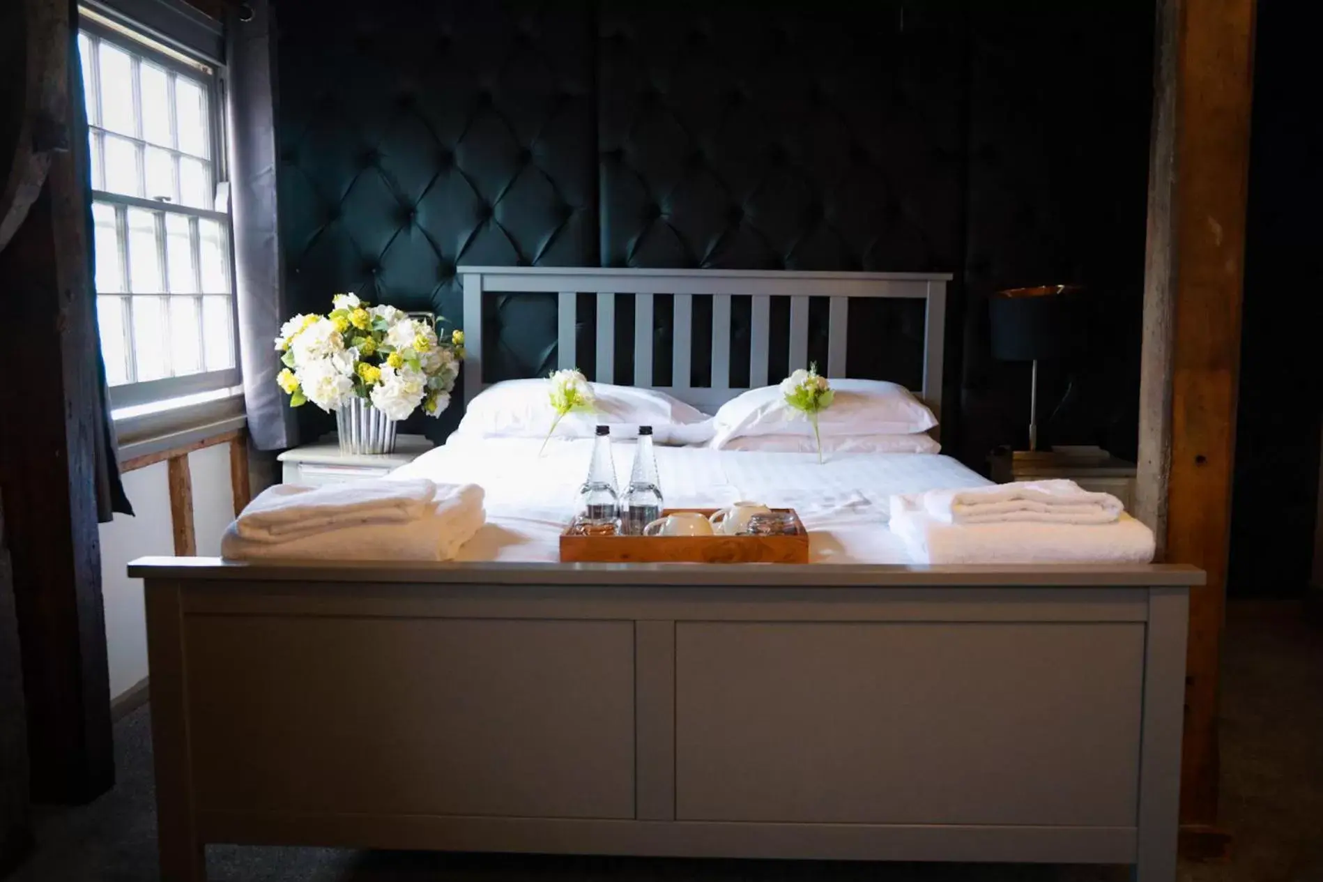 Bed in The Riverside Inn