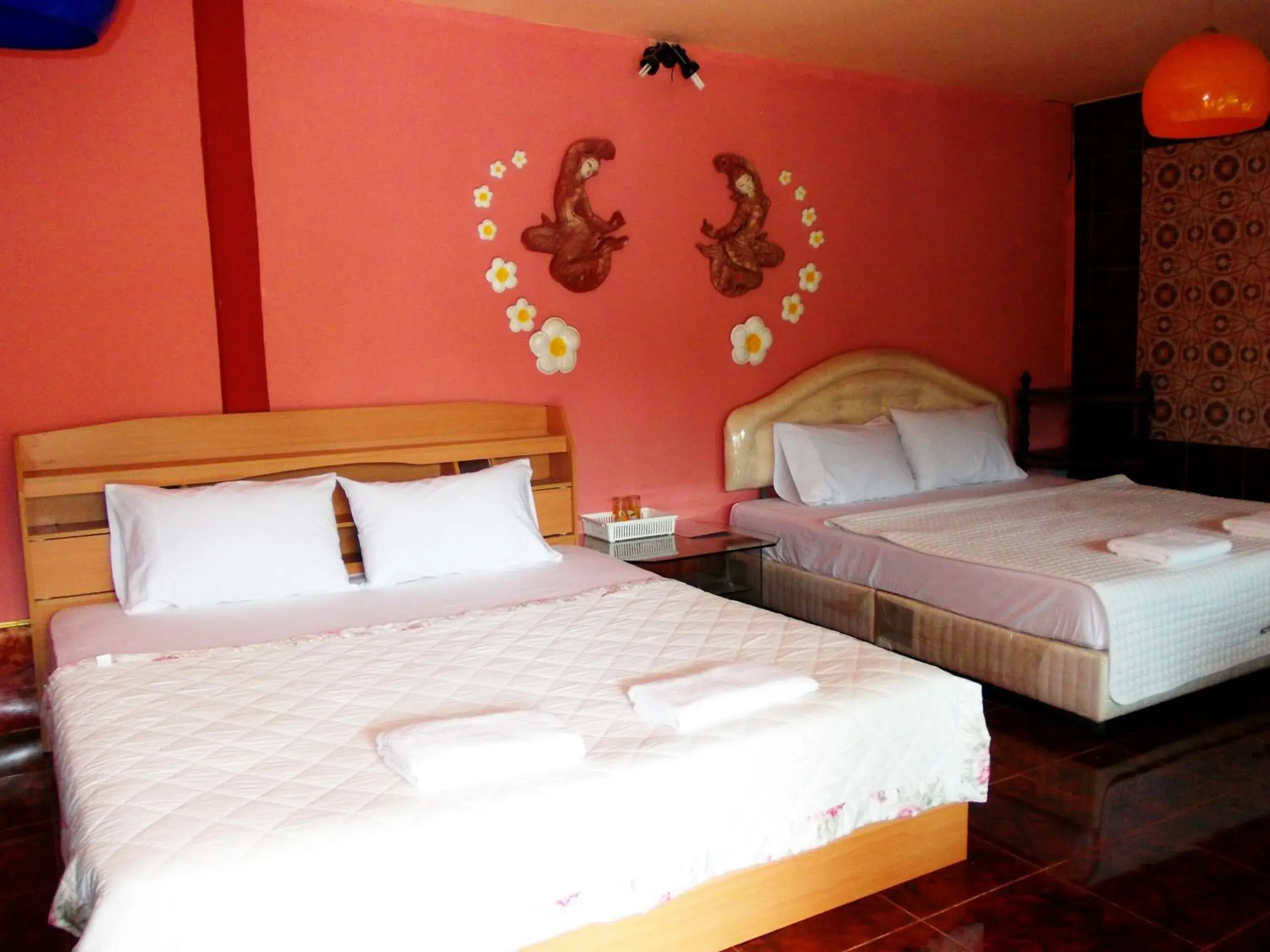 Bed in Suksomjai Hotel