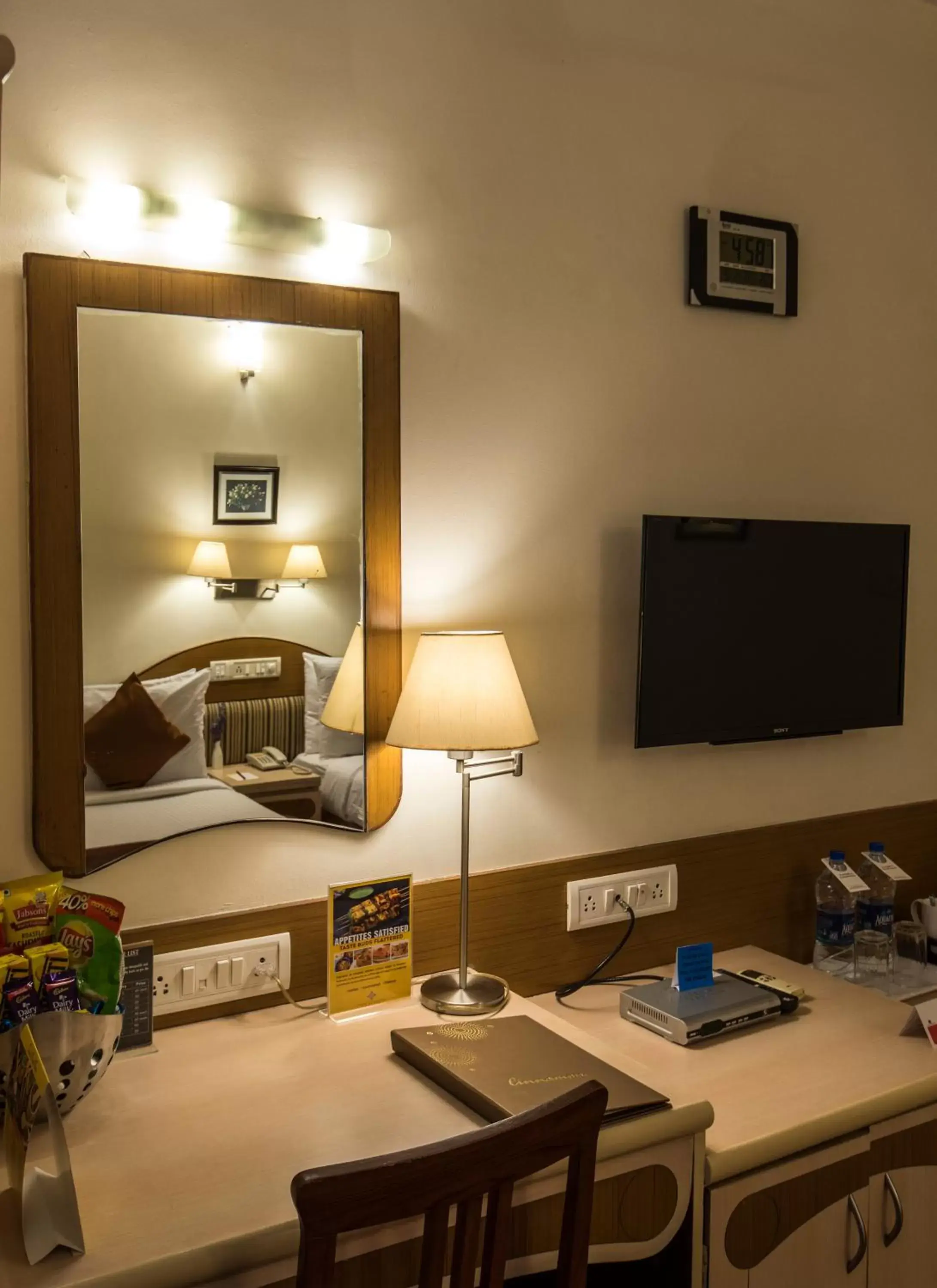 TV and multimedia, TV/Entertainment Center in Hotel Park Central Comfort- E- Suites