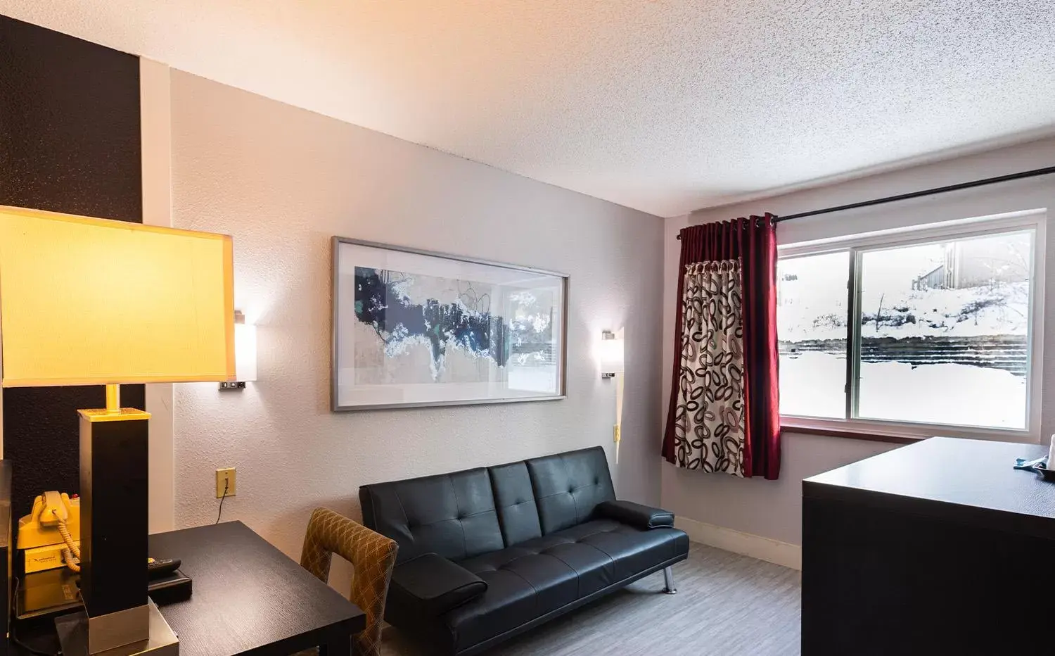 Bed, Seating Area in Coratel Inn & Suites by Jasper Hastings