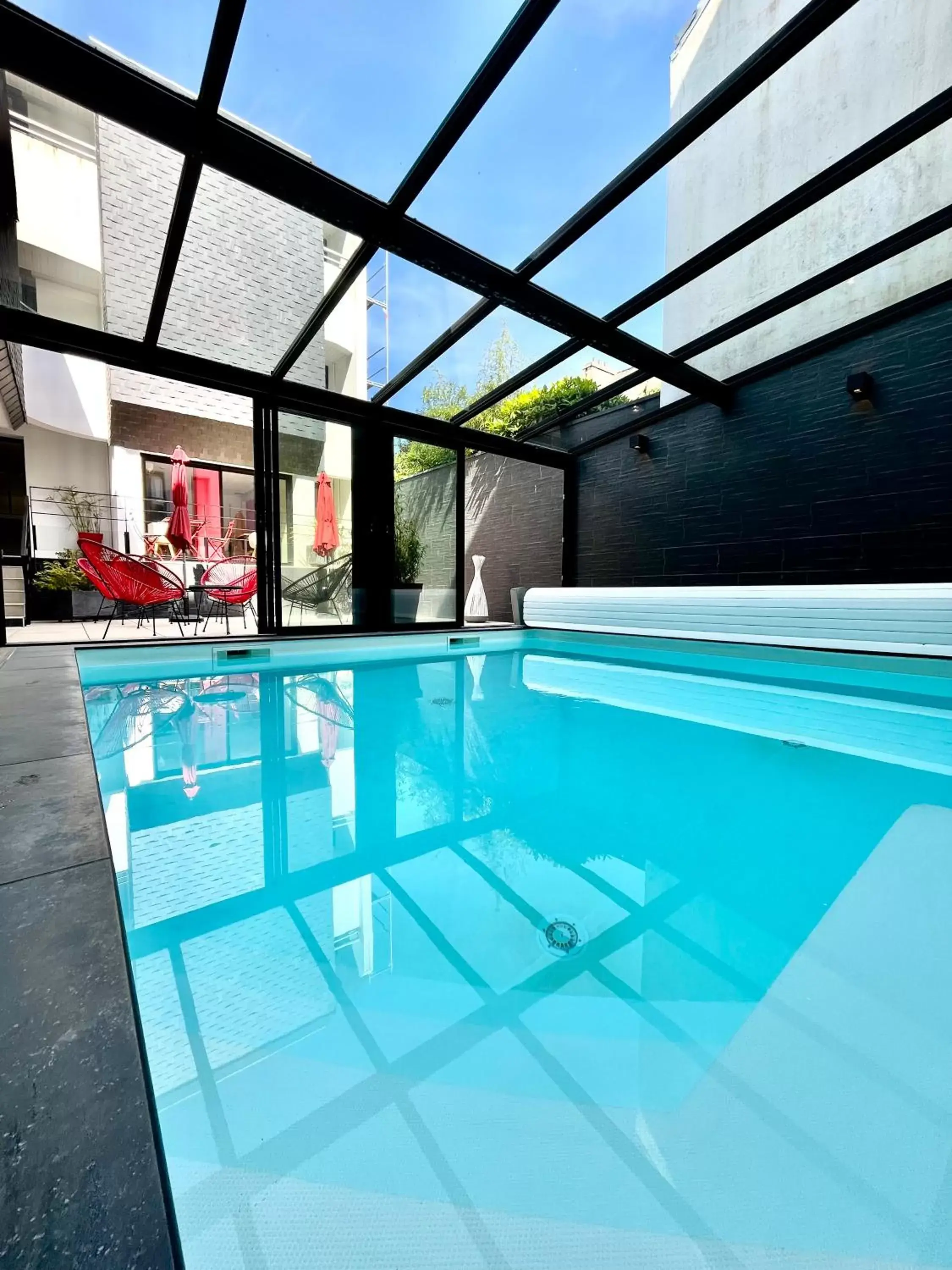 Patio, Swimming Pool in Cit'Hotel Le Cornouaille Hotel