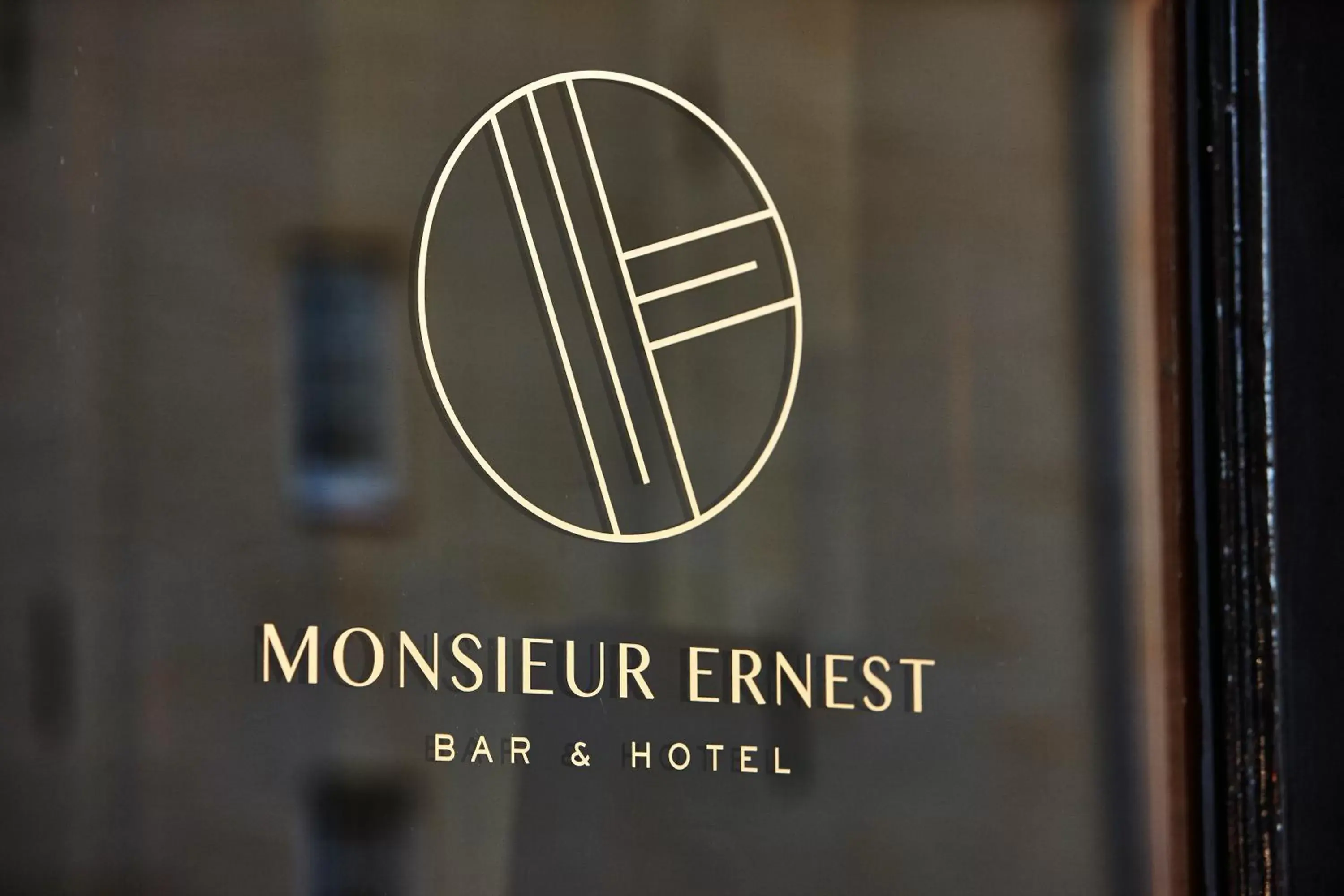 Property logo or sign in Hotel Monsieur Ernest