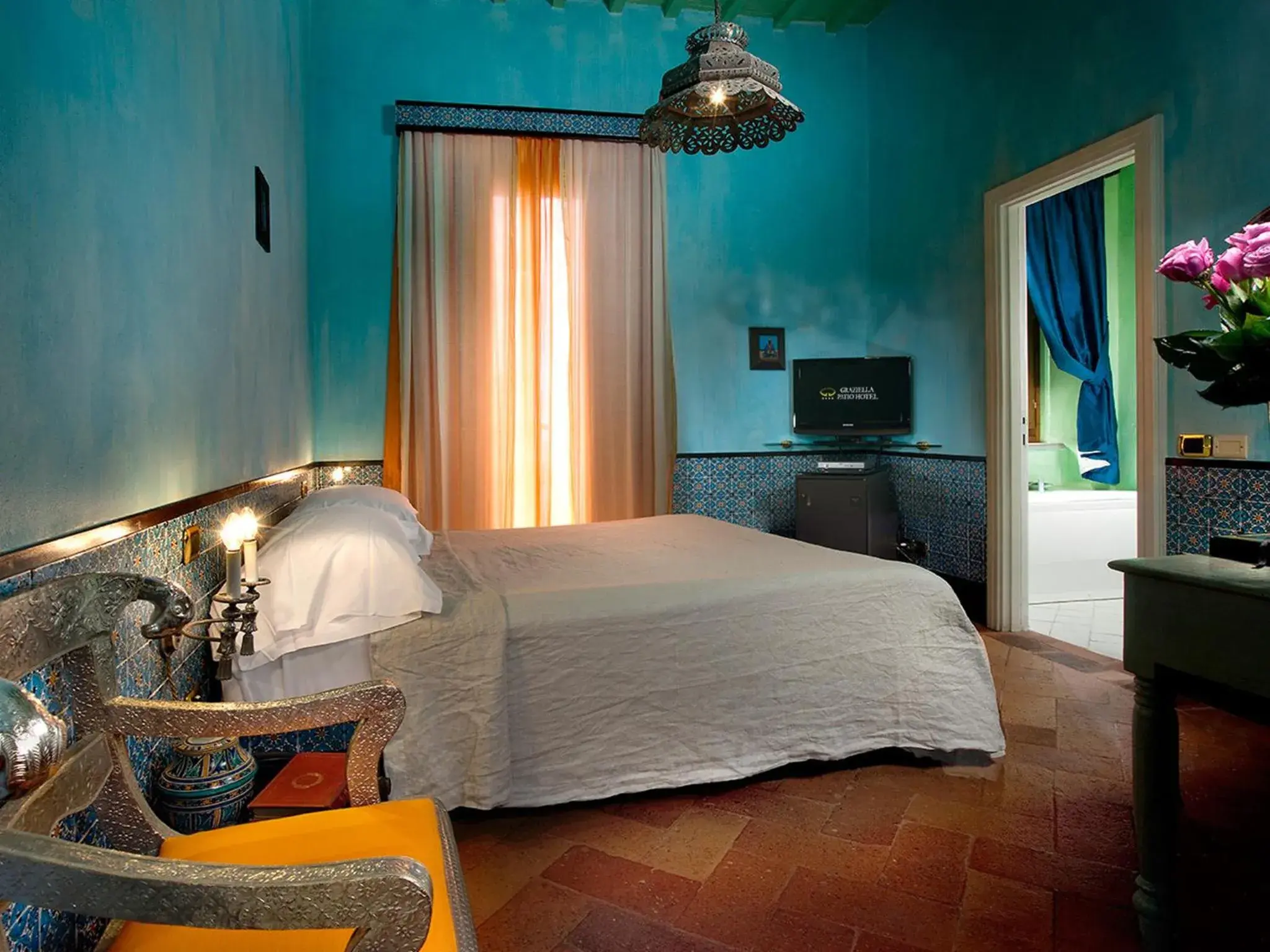 Photo of the whole room, Bed in Graziella Patio Hotel