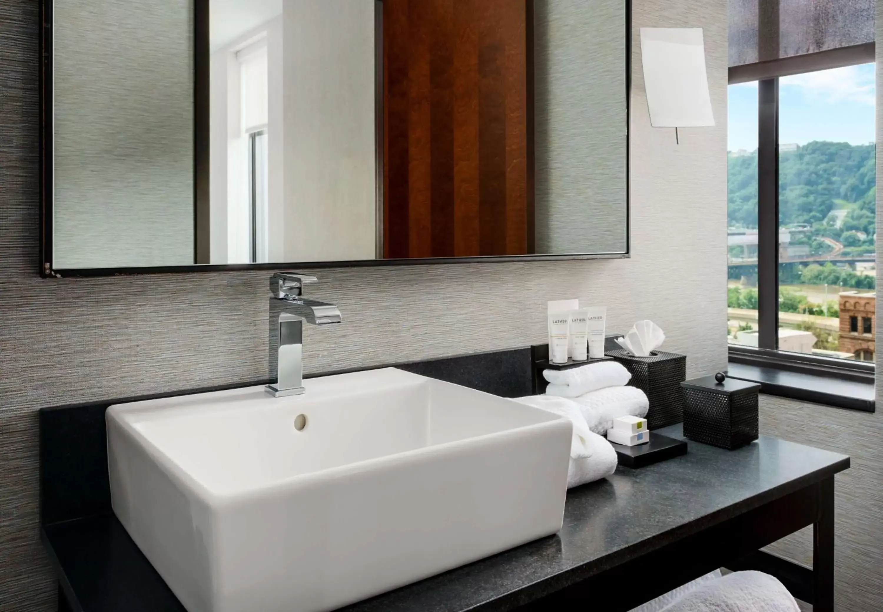 Bathroom in Joinery Hotel Pittsburgh, Curio Collection by Hilton