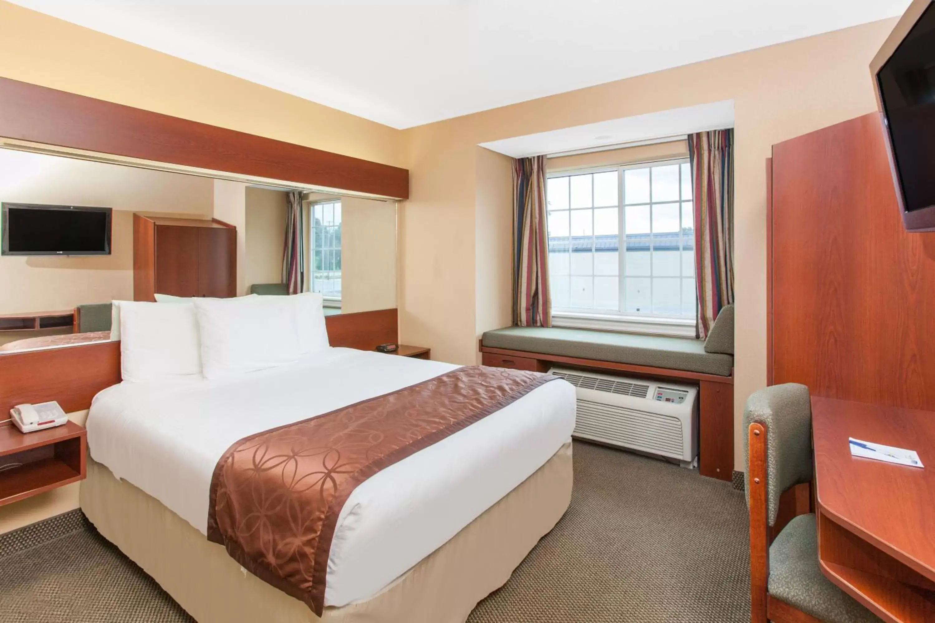 Bed in Microtel Inn by Wyndham Rogers Bed in Microtel Inn by Wyndham Rogers