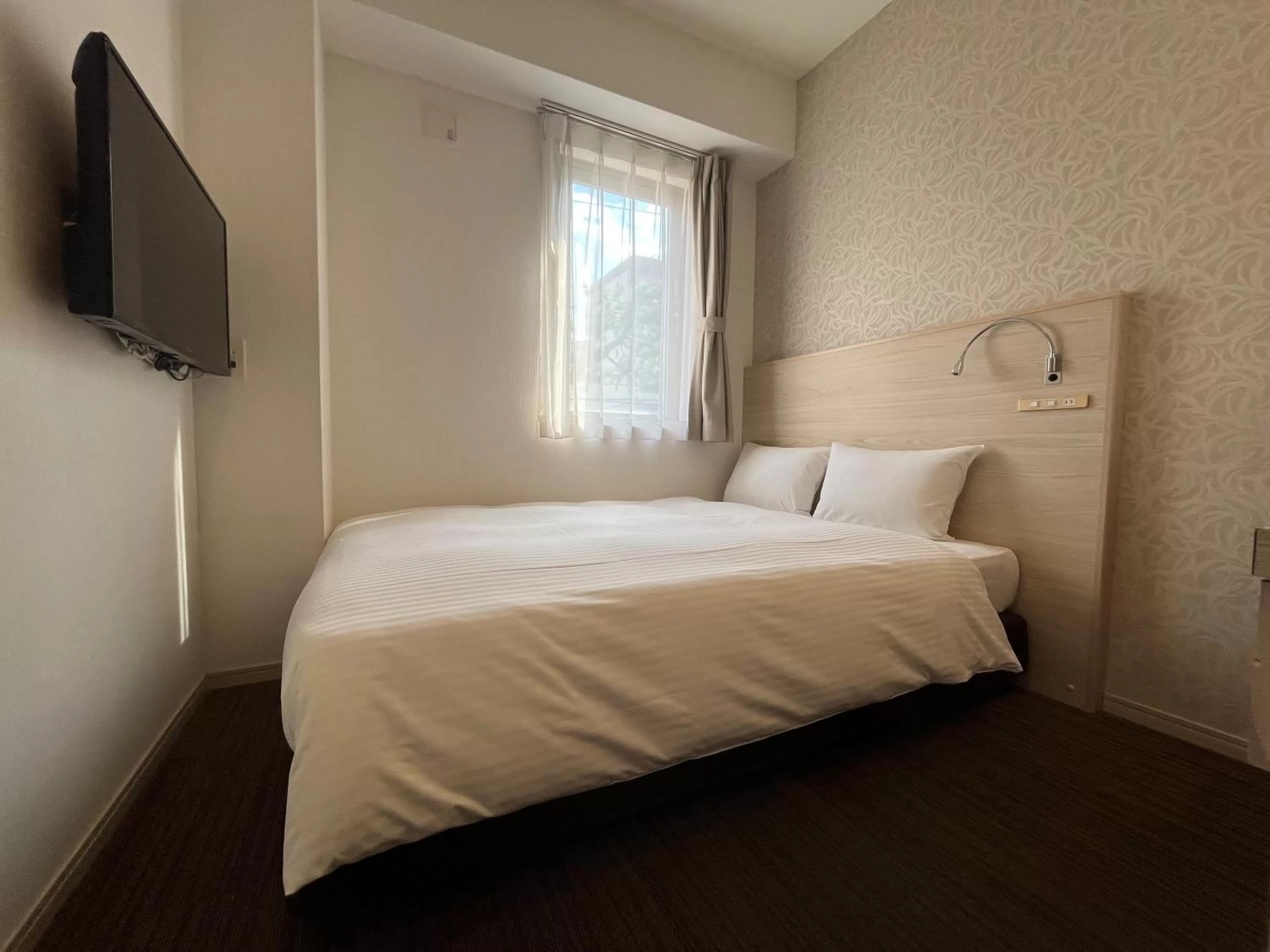 Bed in The BREAKFAST HOTEL Fukuoka Tenjin