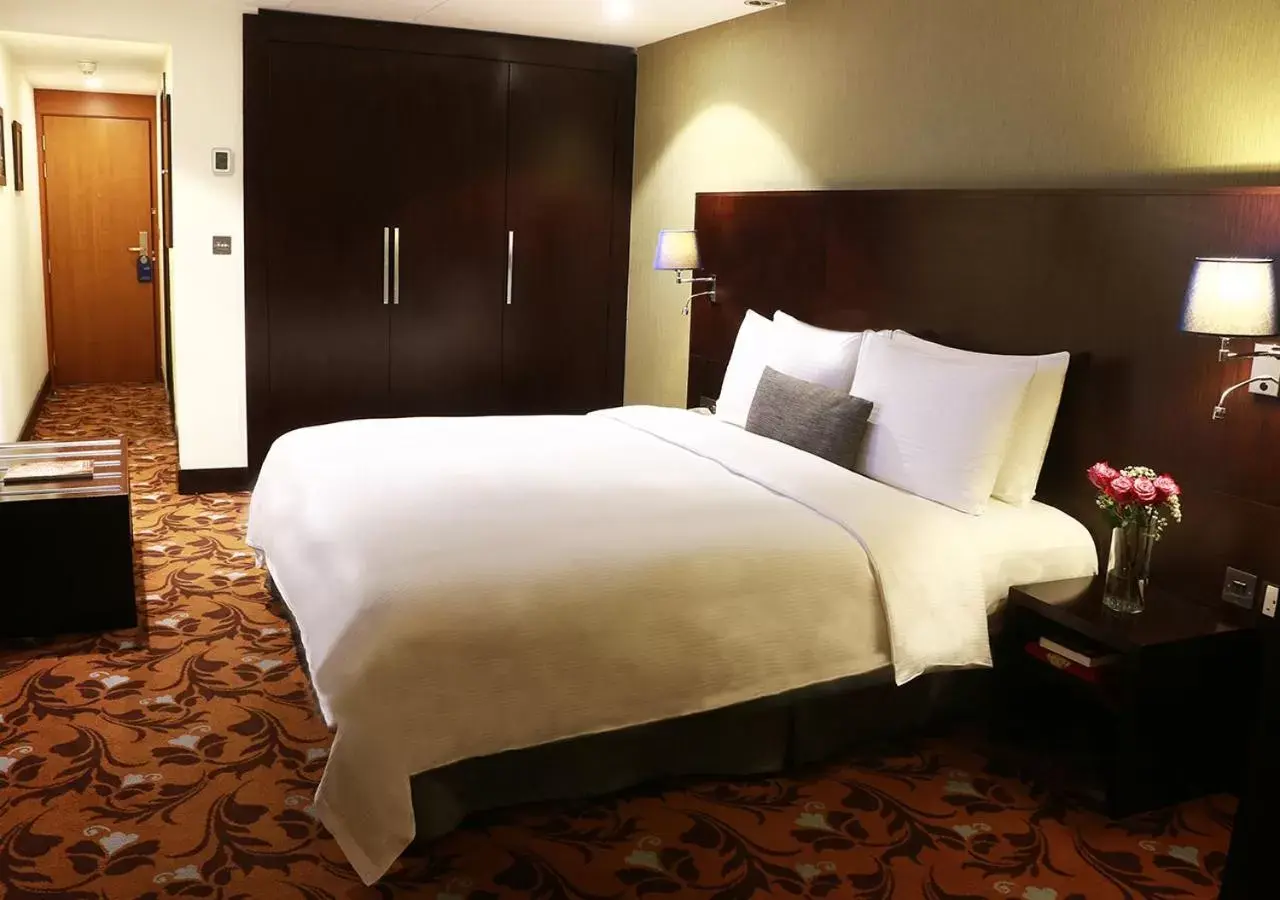 Bed in Babylon Rotana Hotel