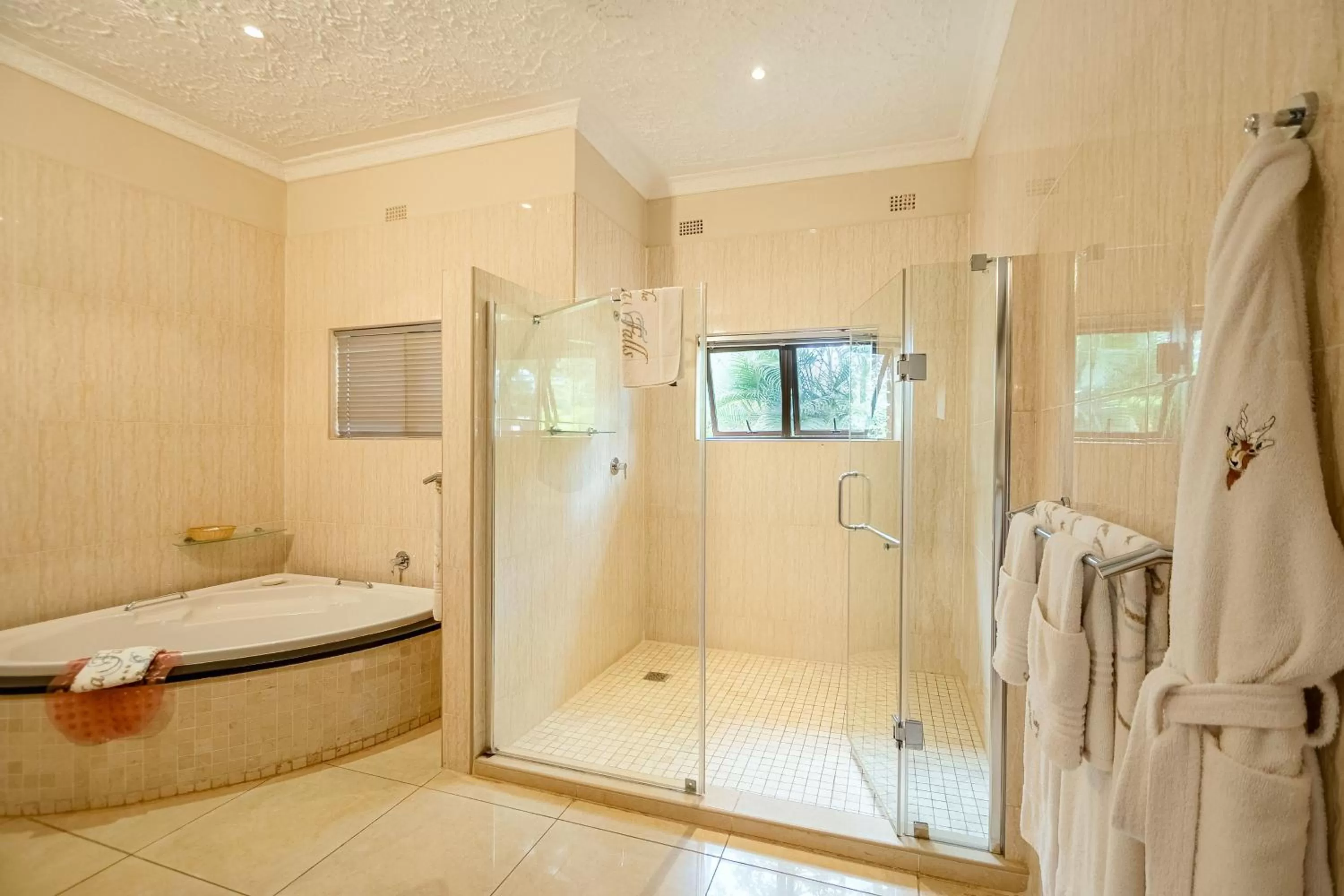 Bathroom, Bed in The Victoria Falls Deluxe Suites