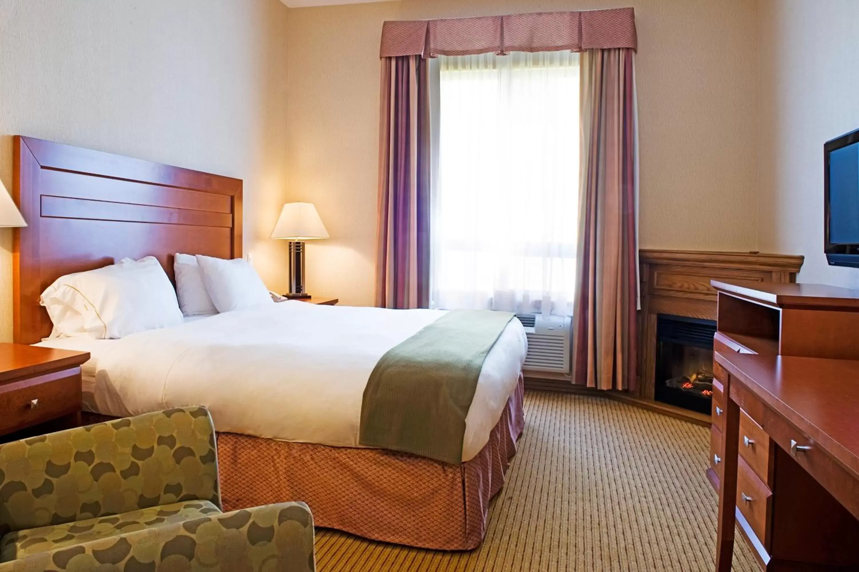 Bed in Holiday Inn Express Grande Prairie, an IHG Hotel