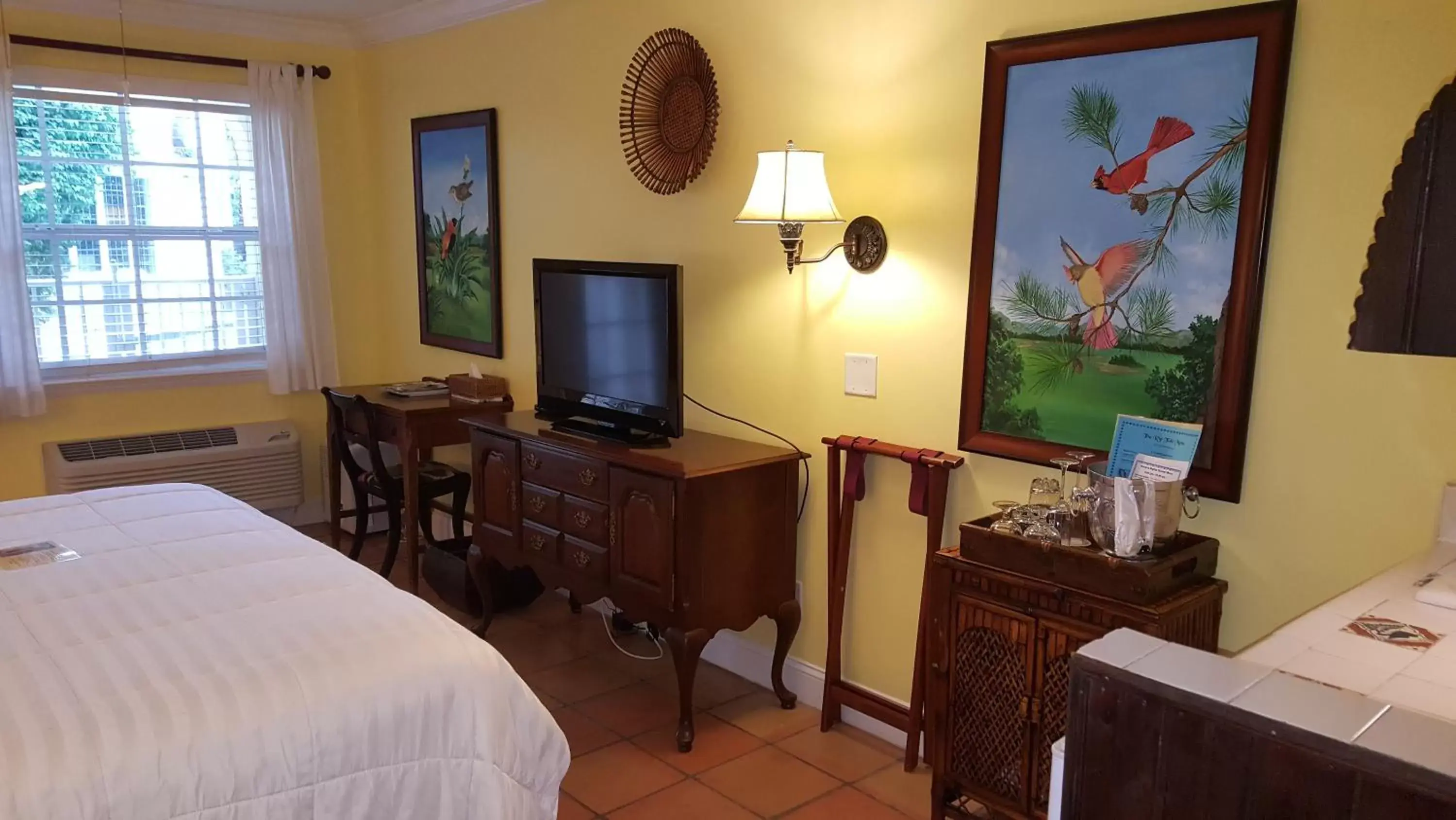 Photo of the whole room, TV/Entertainment Center in The Caribbean Court Boutique Hotel
