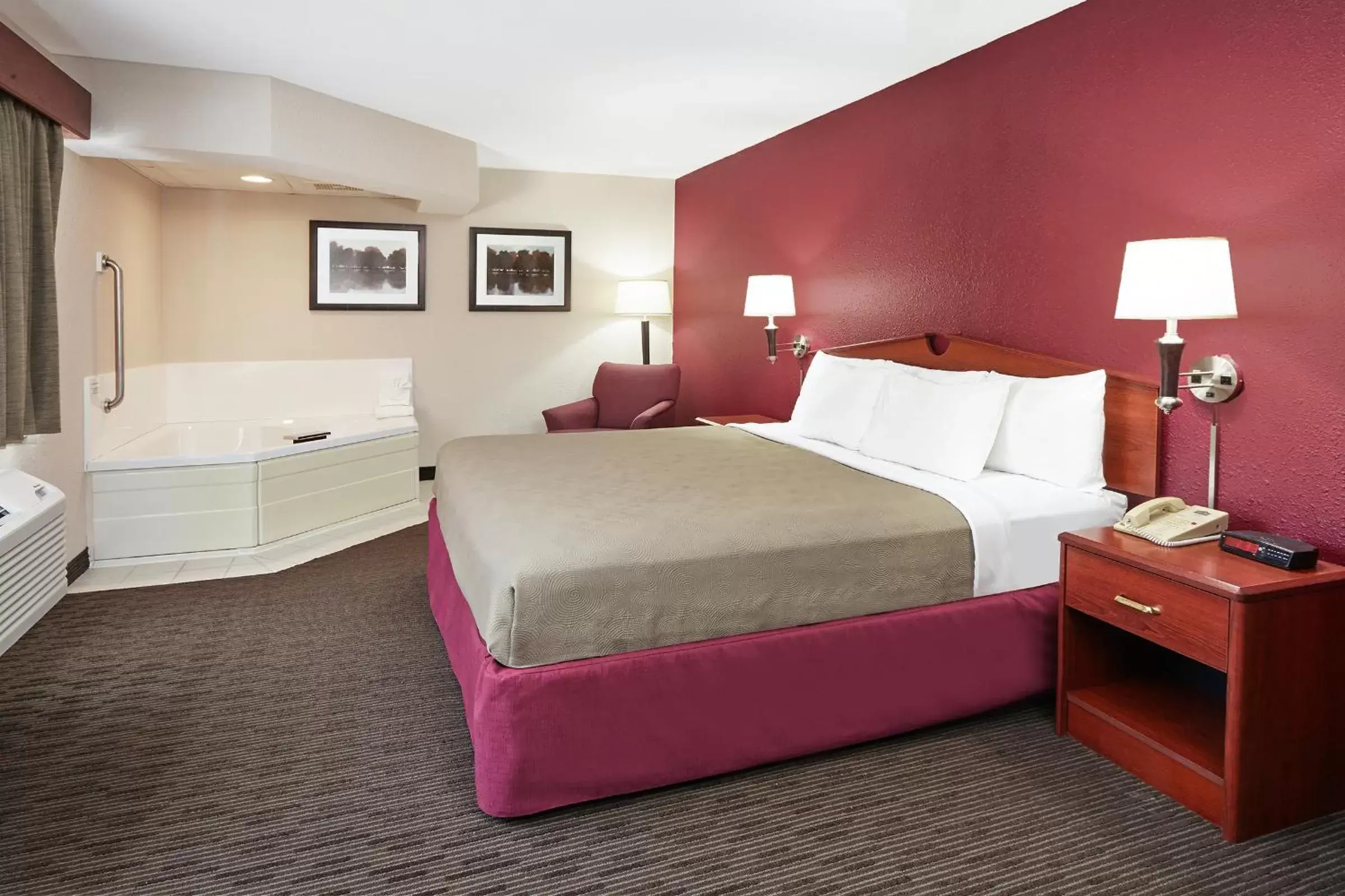 Bed in AmericInn by Wyndham Douglas/Saugatuck