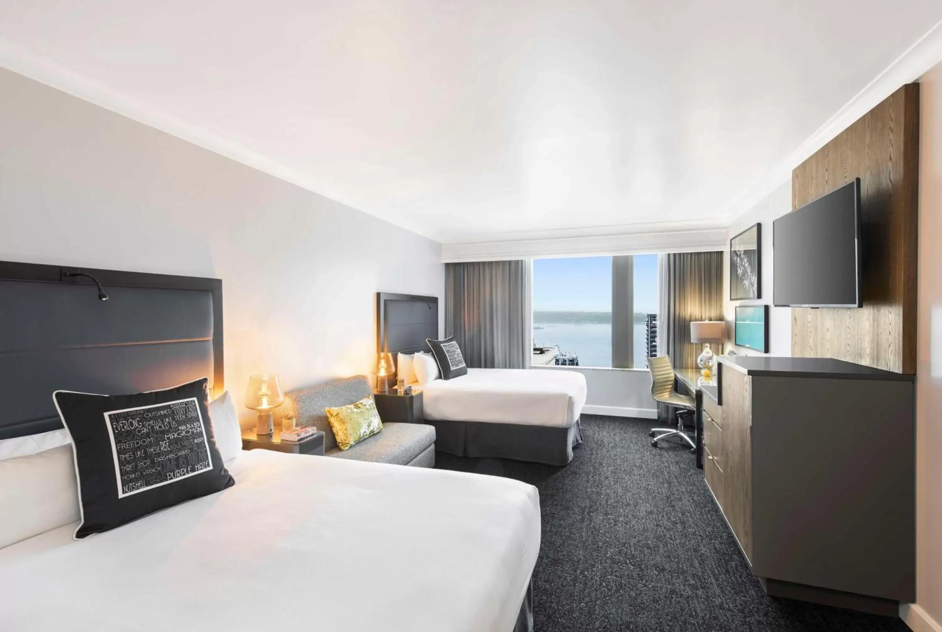 Queen Room with Two Queen Beds - Partial Water and Skyline View in Hilton Motif Seattle