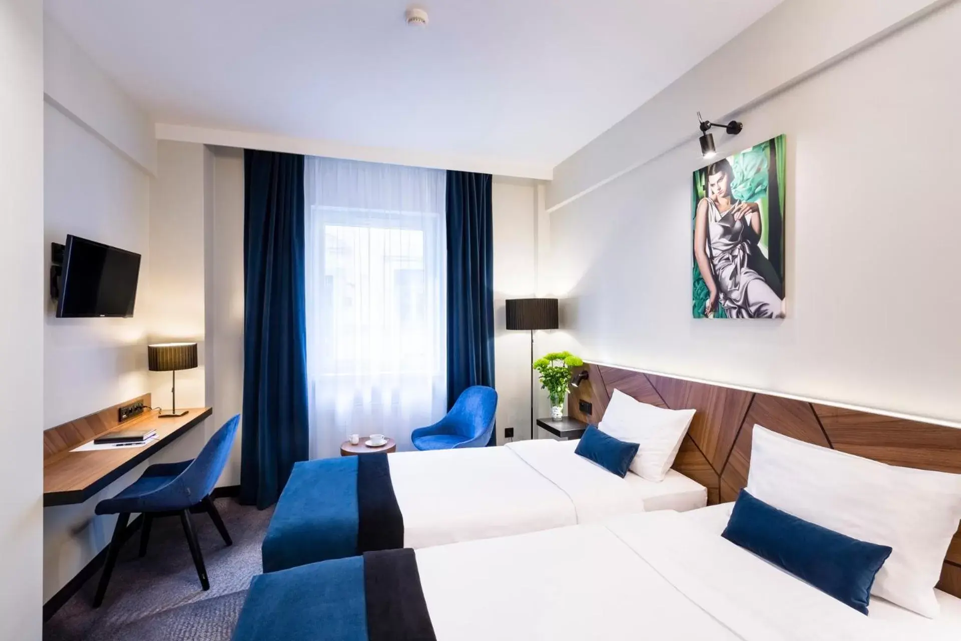 Bed in Ascot Premium Hotel