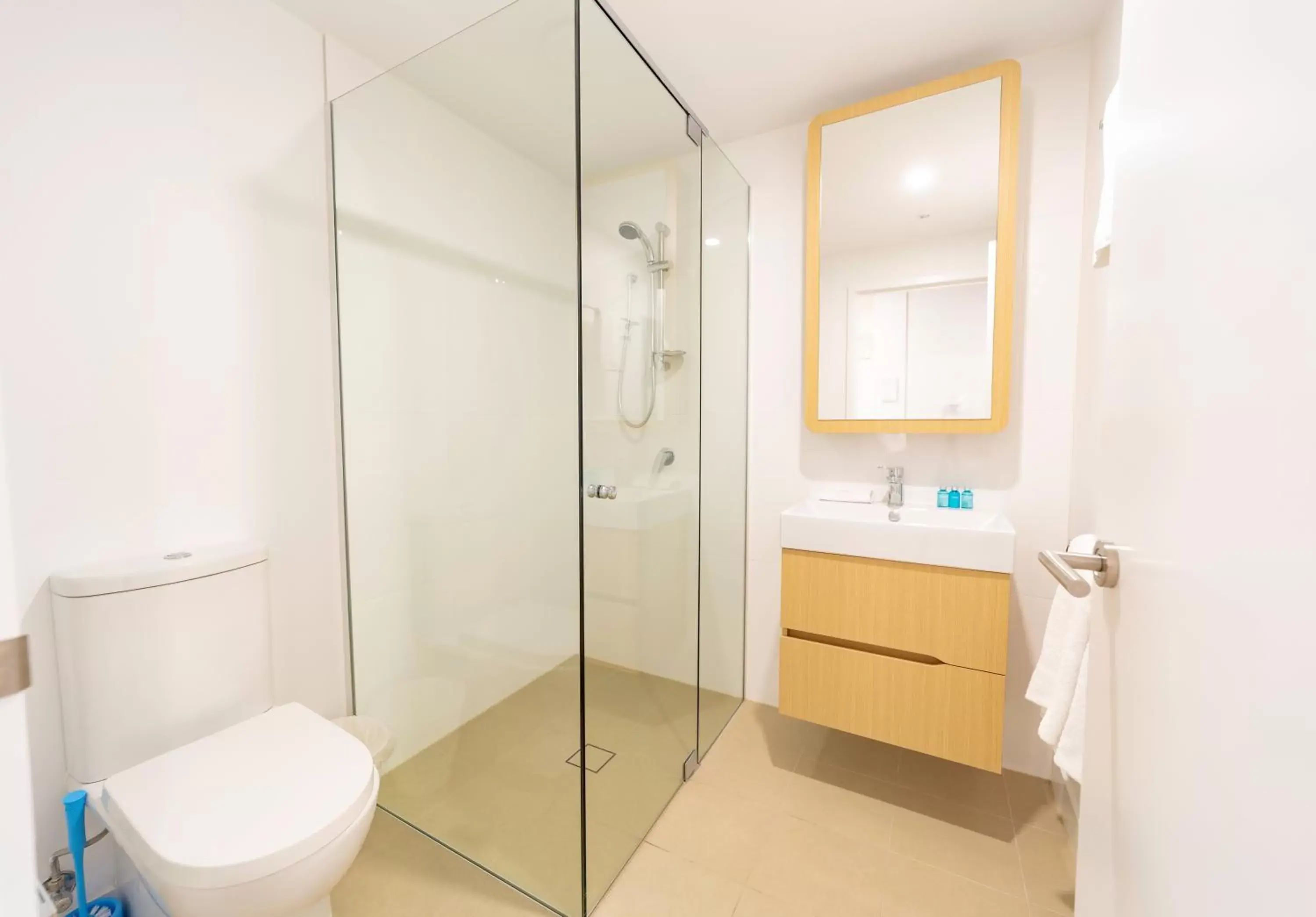 Shower, Bathroom in Brisbane One Apartments by CLLIX