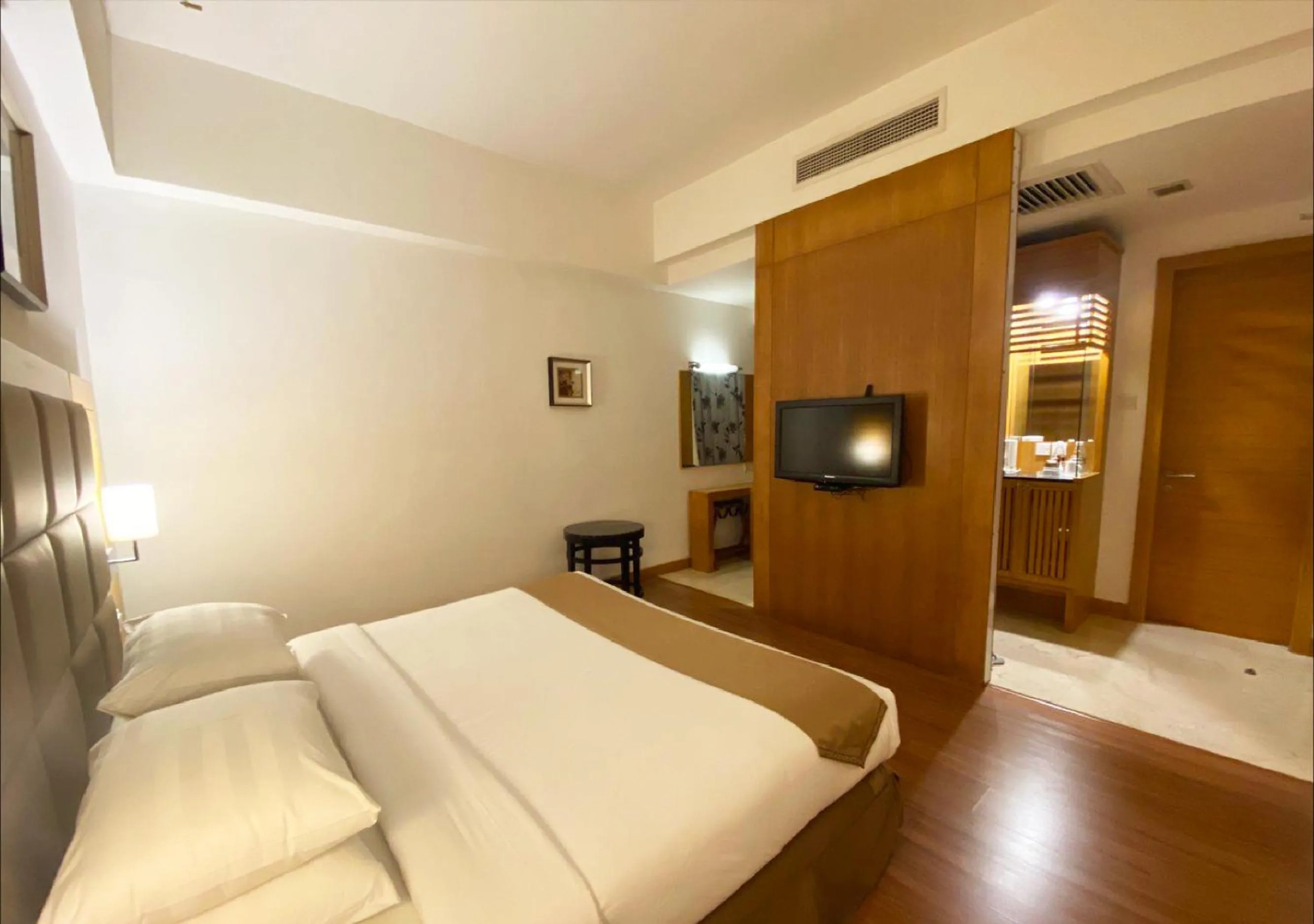 Bed in Crown Garden Hotel