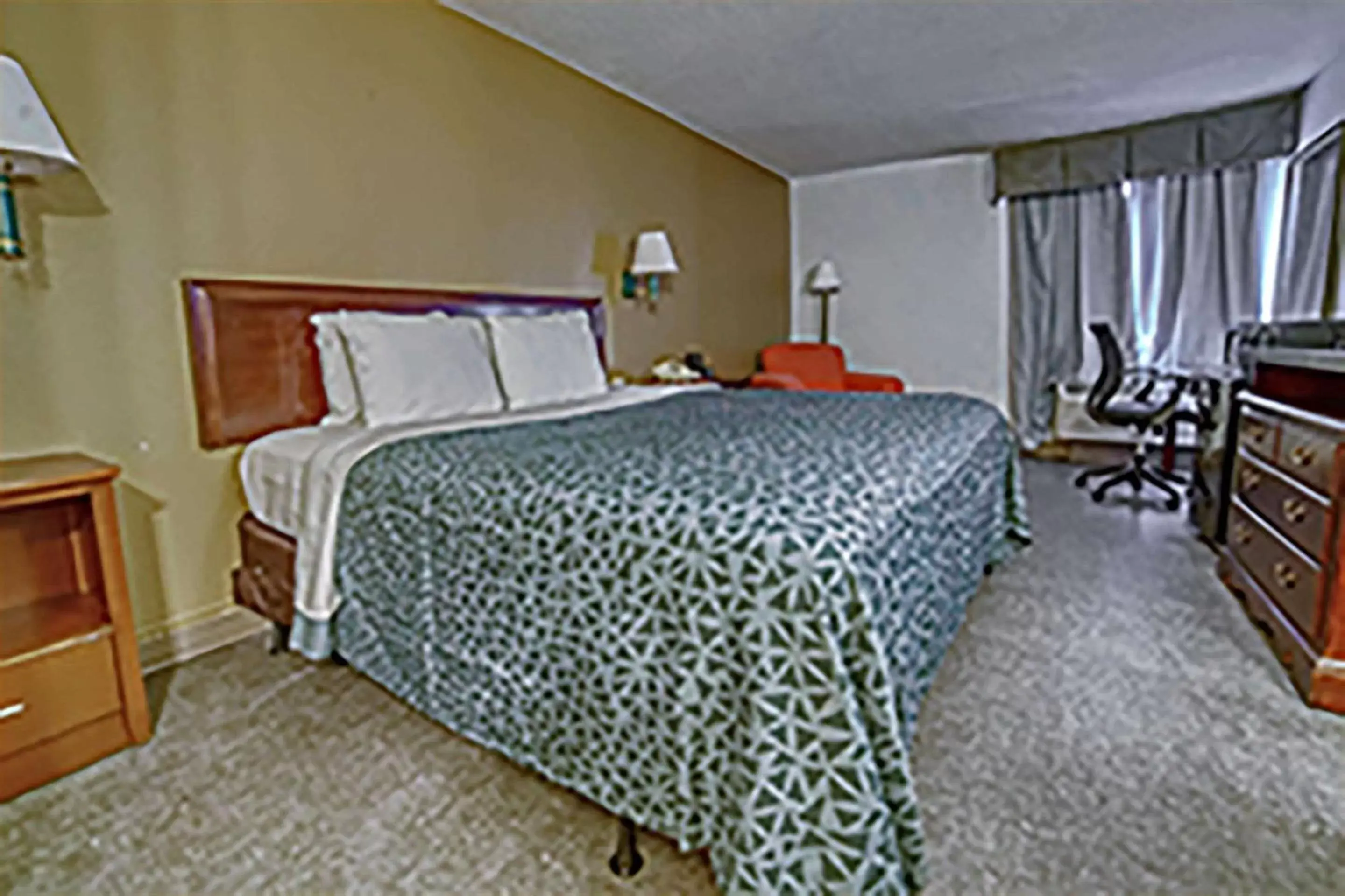 Bedroom, Bed in Econo Lodge Raleigh near Walnut Creek Amphitheatre