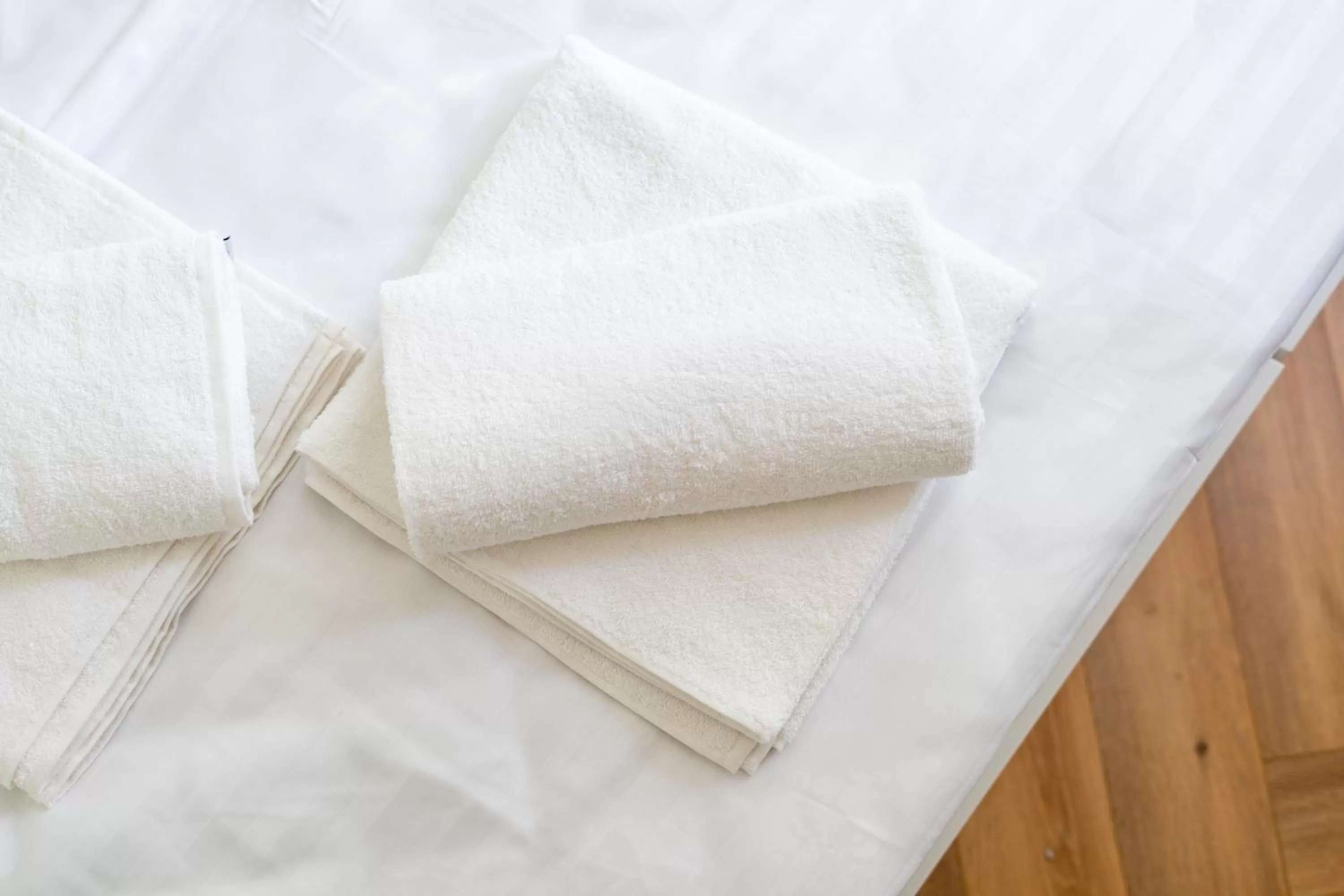 towels, Bed in Oasis Airport Studios by RevalHome