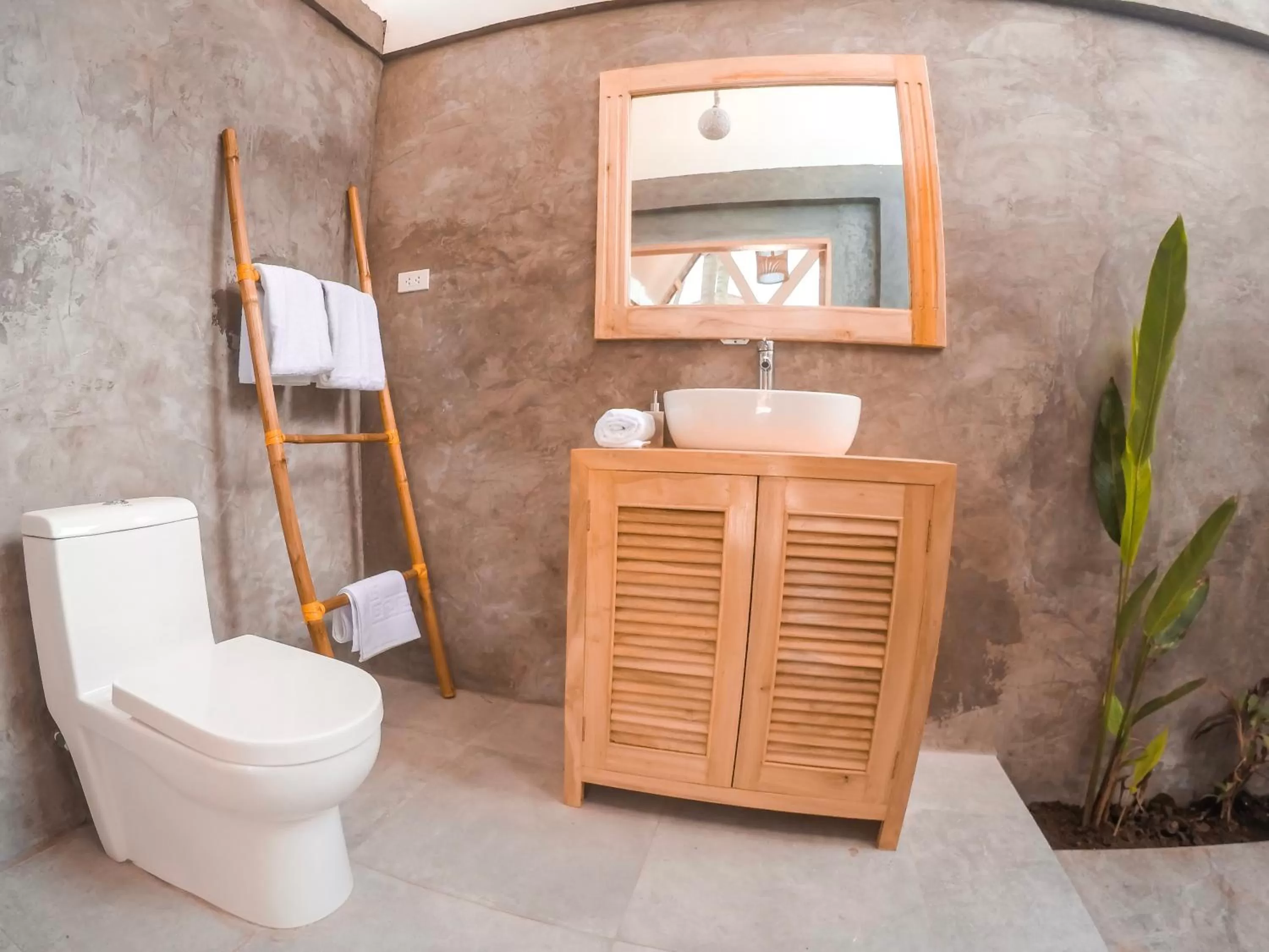 Toilet in Bermuda Triangle Bungalows