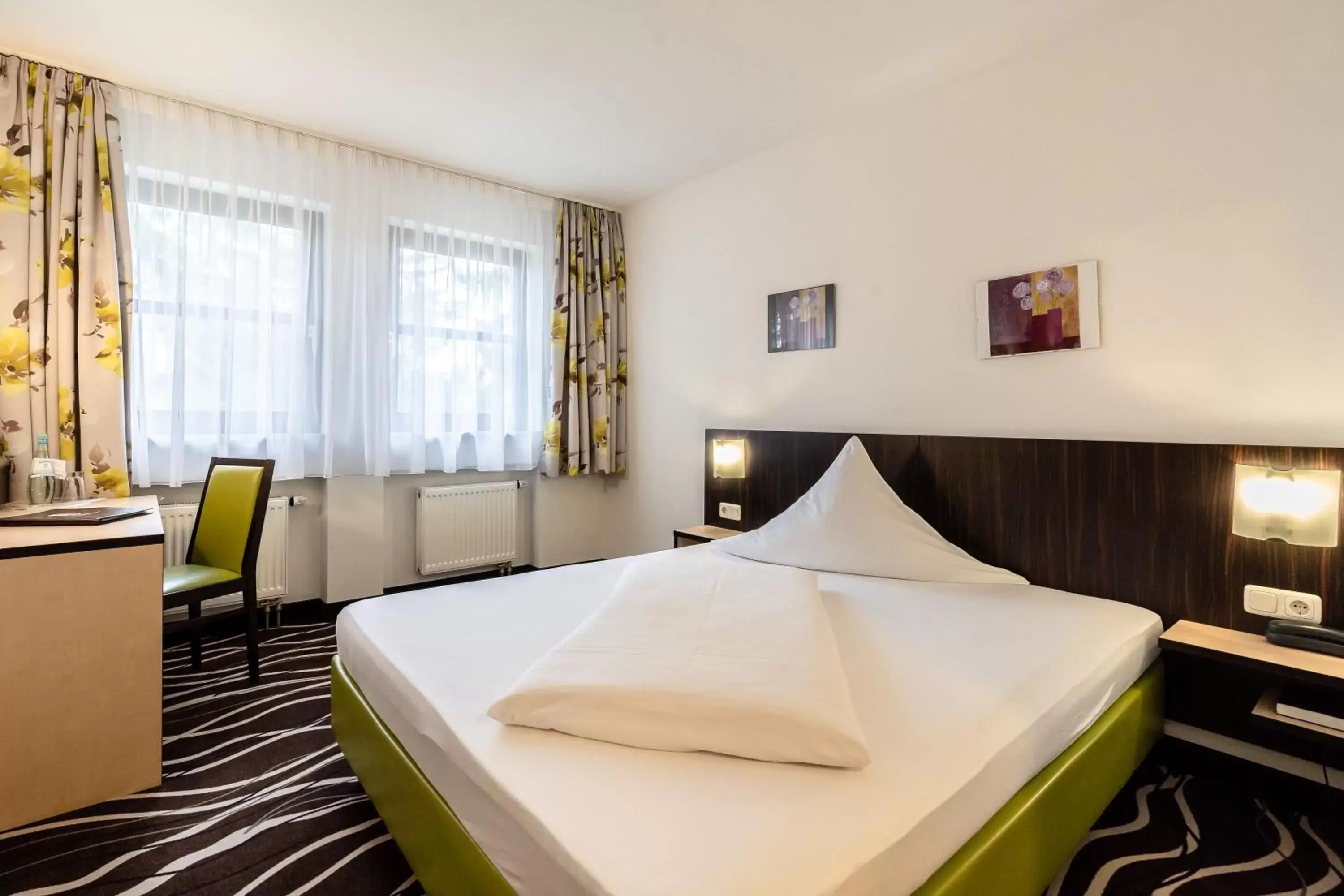 Bed in Hotel Demas Garni