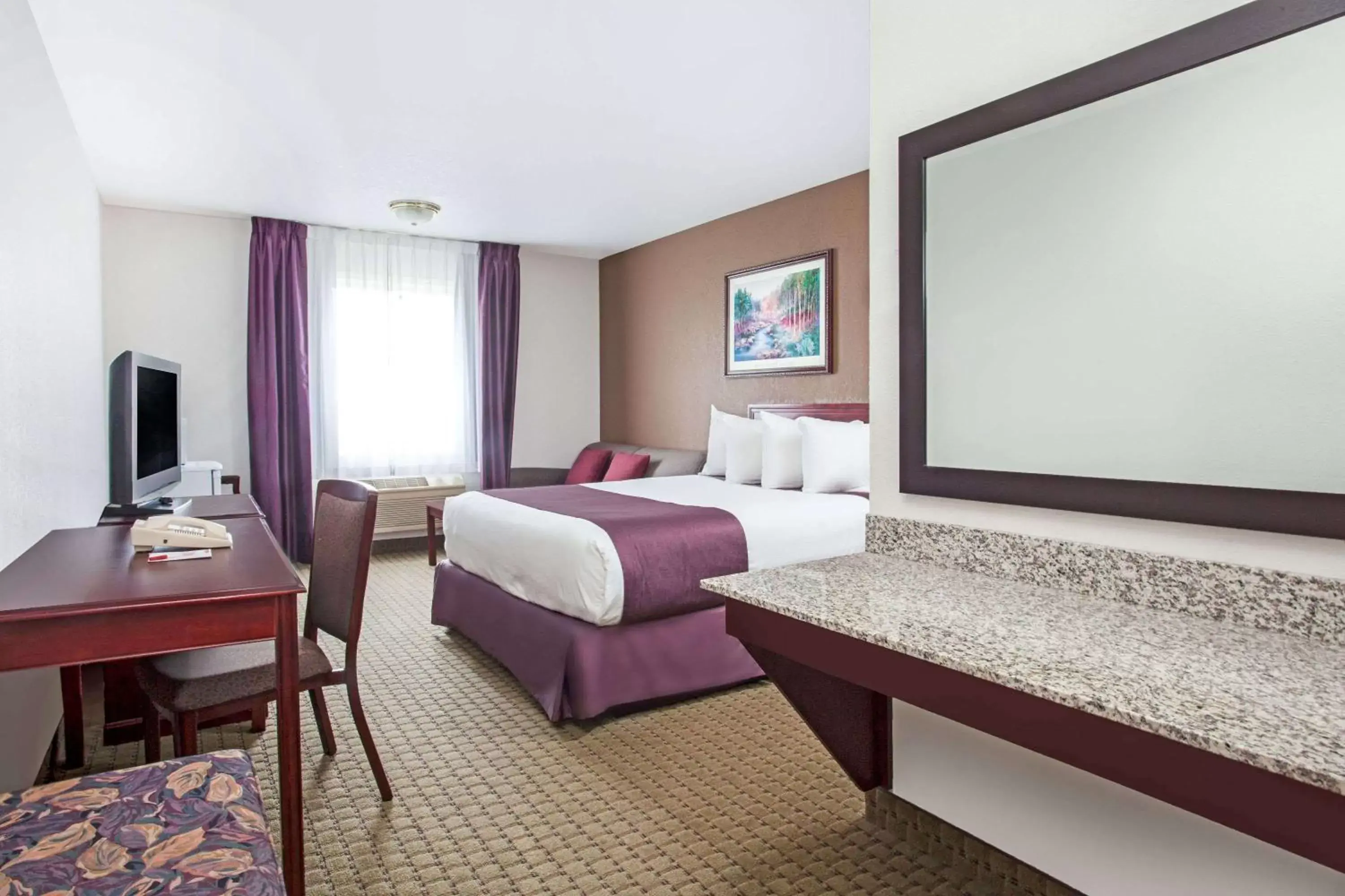 Photo of the whole room, Bed in Ramada by Wyndham Red Deer Hotel & Suites