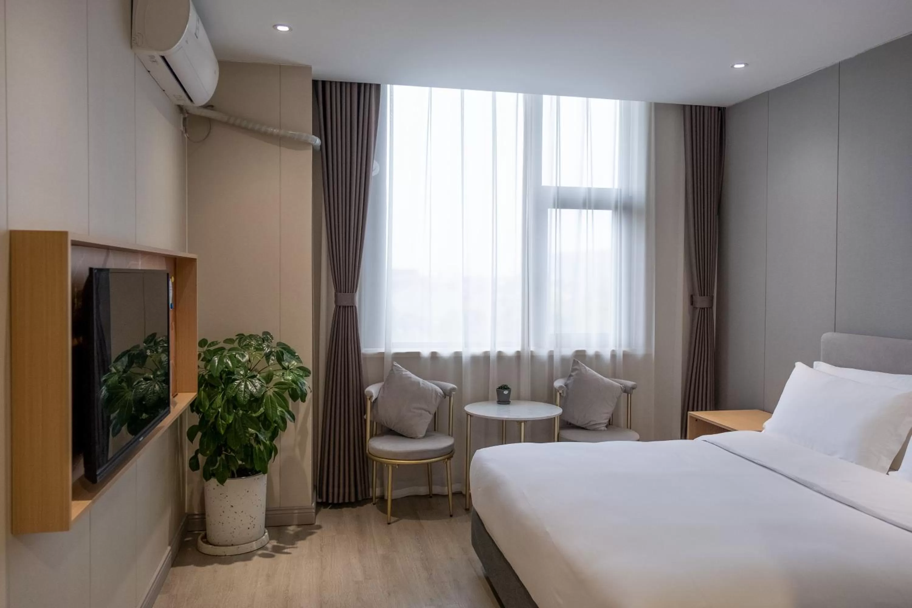 Bed in Shanghai JOYFUL YARD Hotel-Free shuttle bus to Pudong Airport and Disneyland